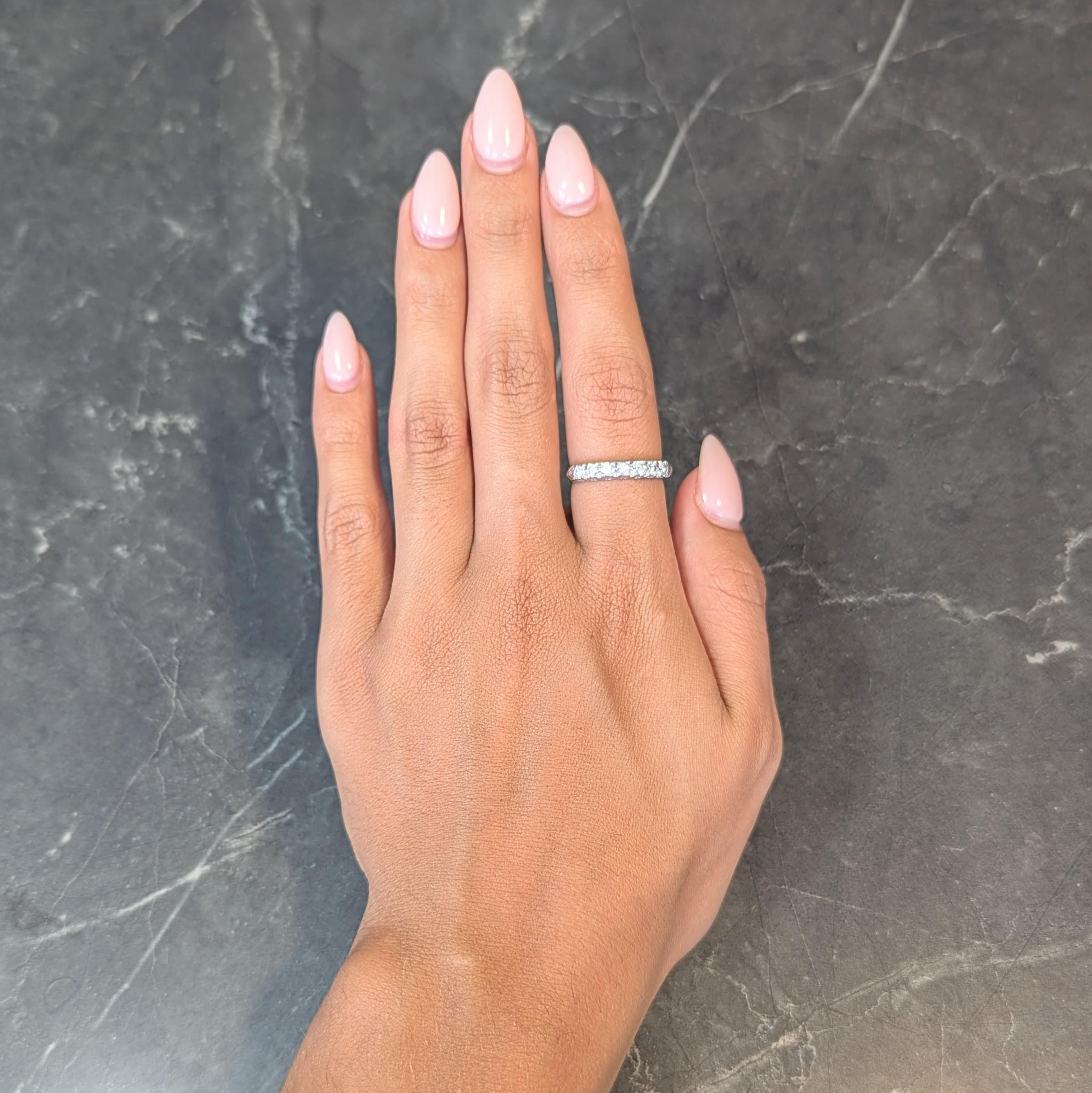 Featuring a row of seven transitional cut diamonds prong set east to west
Weighing approximately 0.56 carat total - G /I color with VS2 clarity
With fishtail profile and chevron shoulders 
Completed by knife edge shank
Stamped for platinum
Circa: