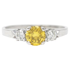 Mid-Century 0.74 Carat Fancy Yellow Diamond 3 Stone Platinum Engagement Ring GIA
