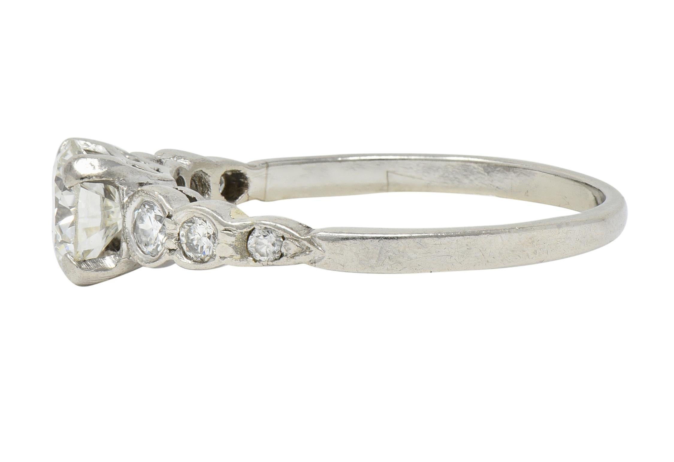 Women's or Men's Mid-Century 0.94 CTW Diamond Platinum Seven Stone Vintage Engagement Ring For Sale