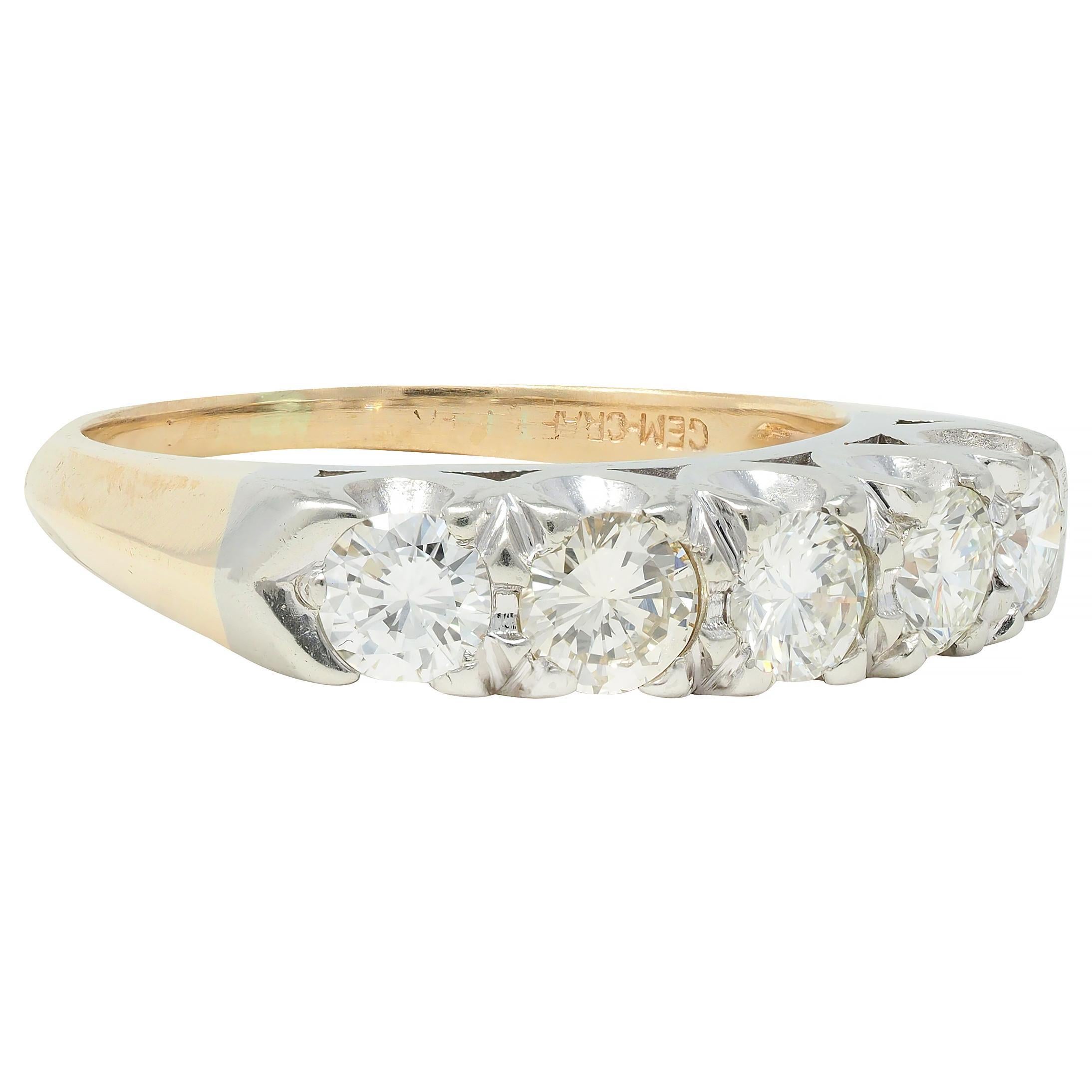 Featuring five round brilliant cut diamonds prong set in white gold east to west 
Weighing approximately 1.00 carats total - J to L color with VS2 clarity
Flanked by knife edge yellow gold shoulders and shank 
Tested as 14 karat gold 
With maker's