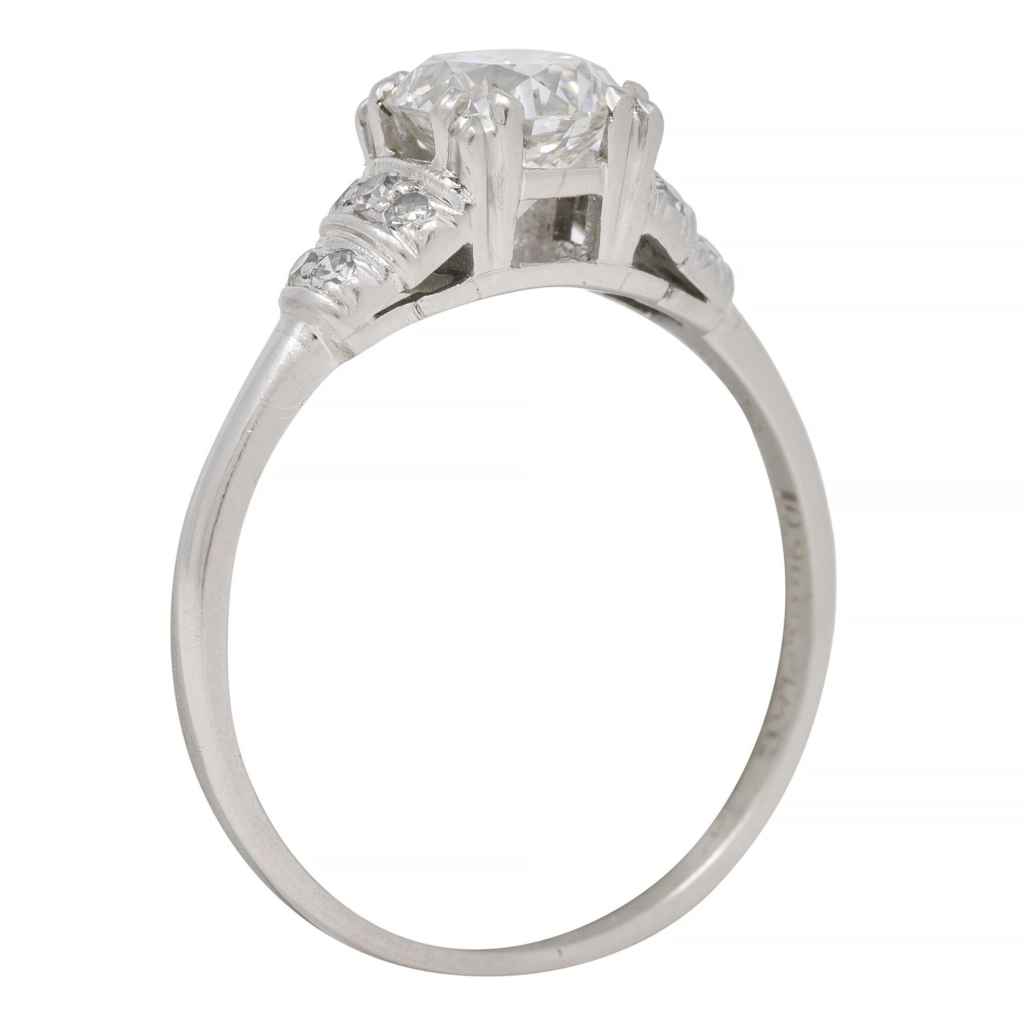 Centering an old European cut diamond weighing approximately 1.08 carats - G color with SI2 clarity
Set in a basket with tri-split prongs and flanked by cathedral shoulders
Accented by tiered rows of bead set single cut diamonds
Weighing