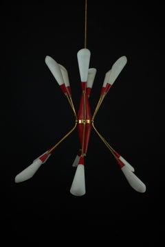 Mid-Century 12 lights chandelier in the manner of Stilnovo. Italy 1950s