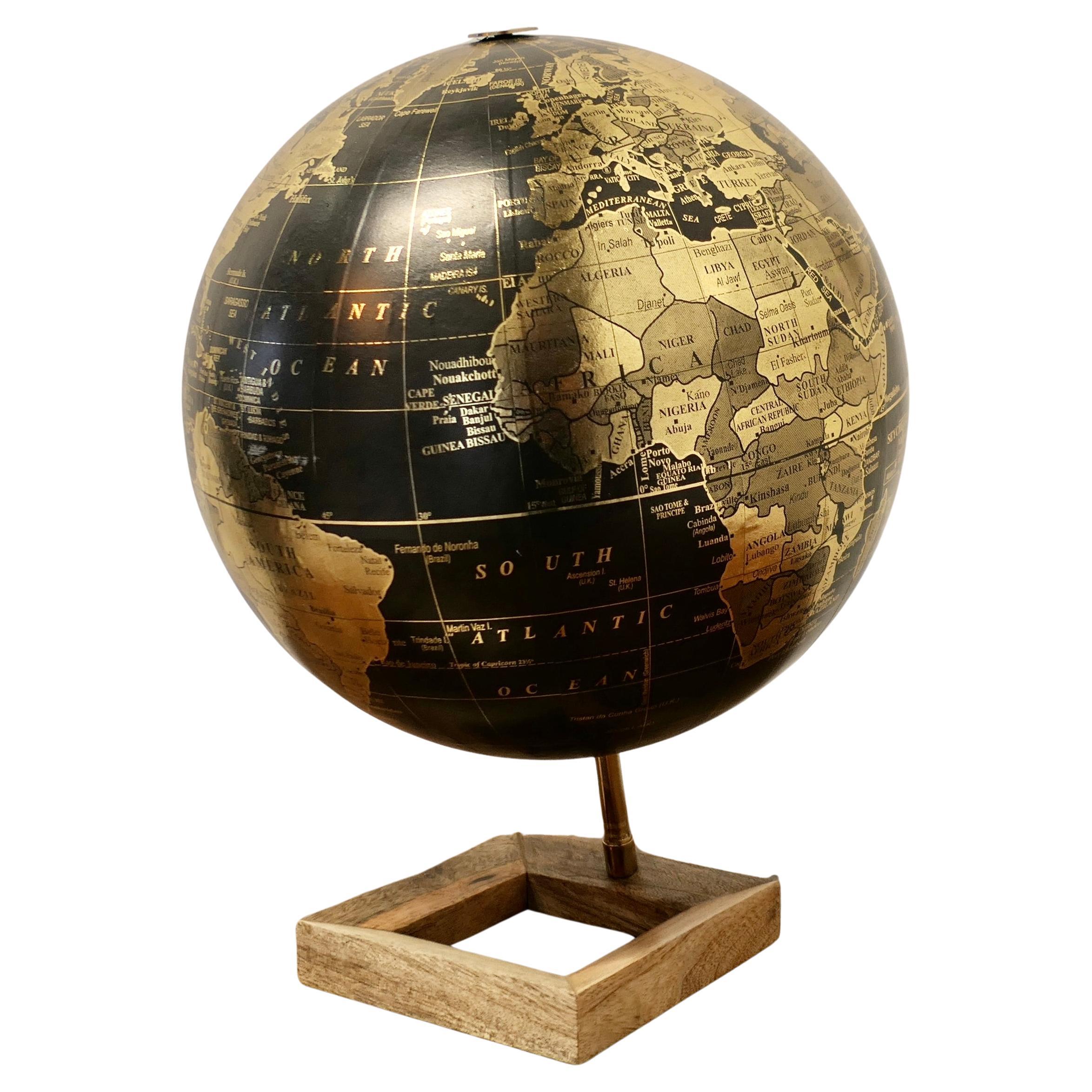 Mid Century 12” Terrestrial Black and Gold Globe For Sale