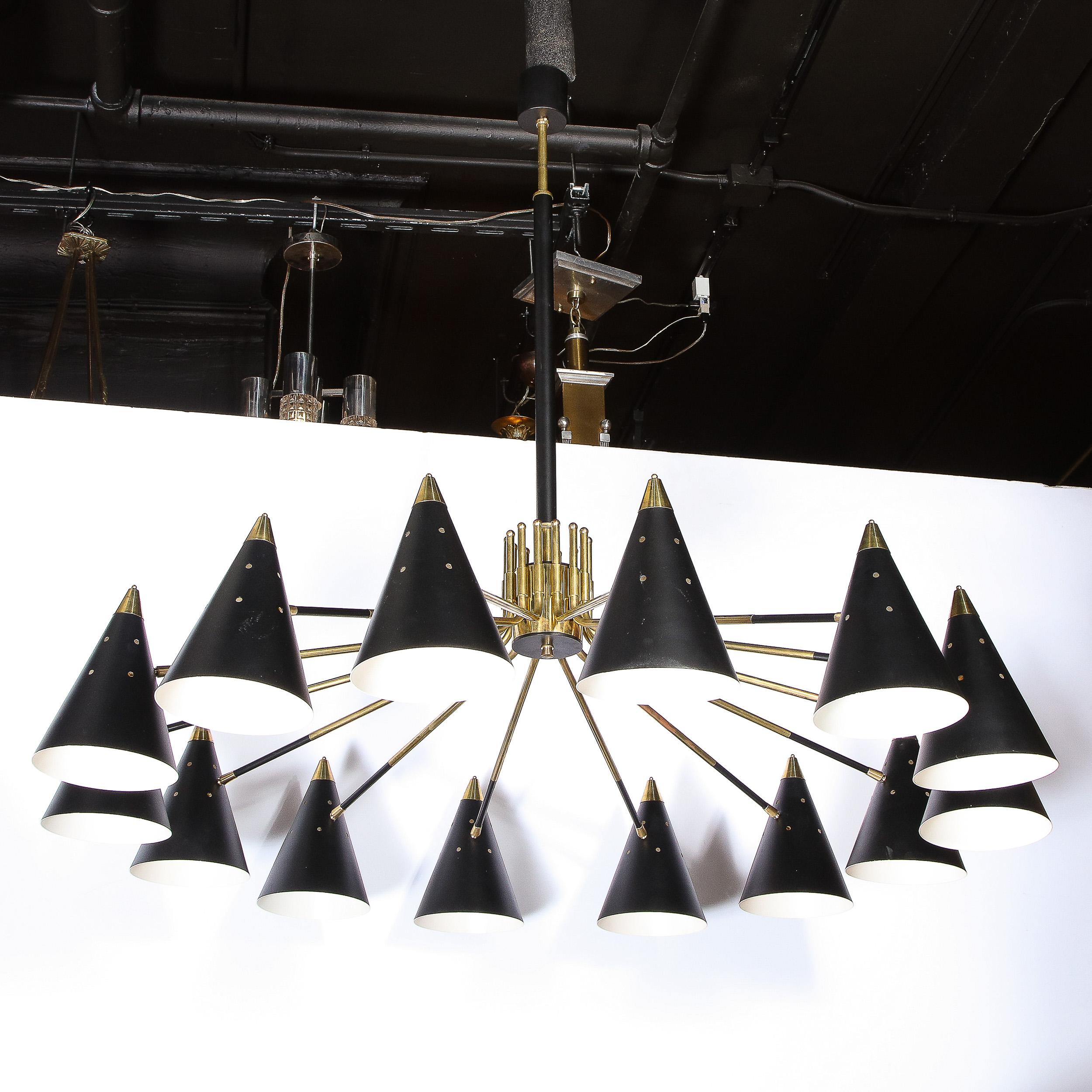 This graphic and monumental Mid-Century Modern chandelier was realized in Italy, circa 1960. A cylindrical brass rod descends from a circular canopy where it segues into a thicker black enamel rod that culminates in the cylindrical body of the