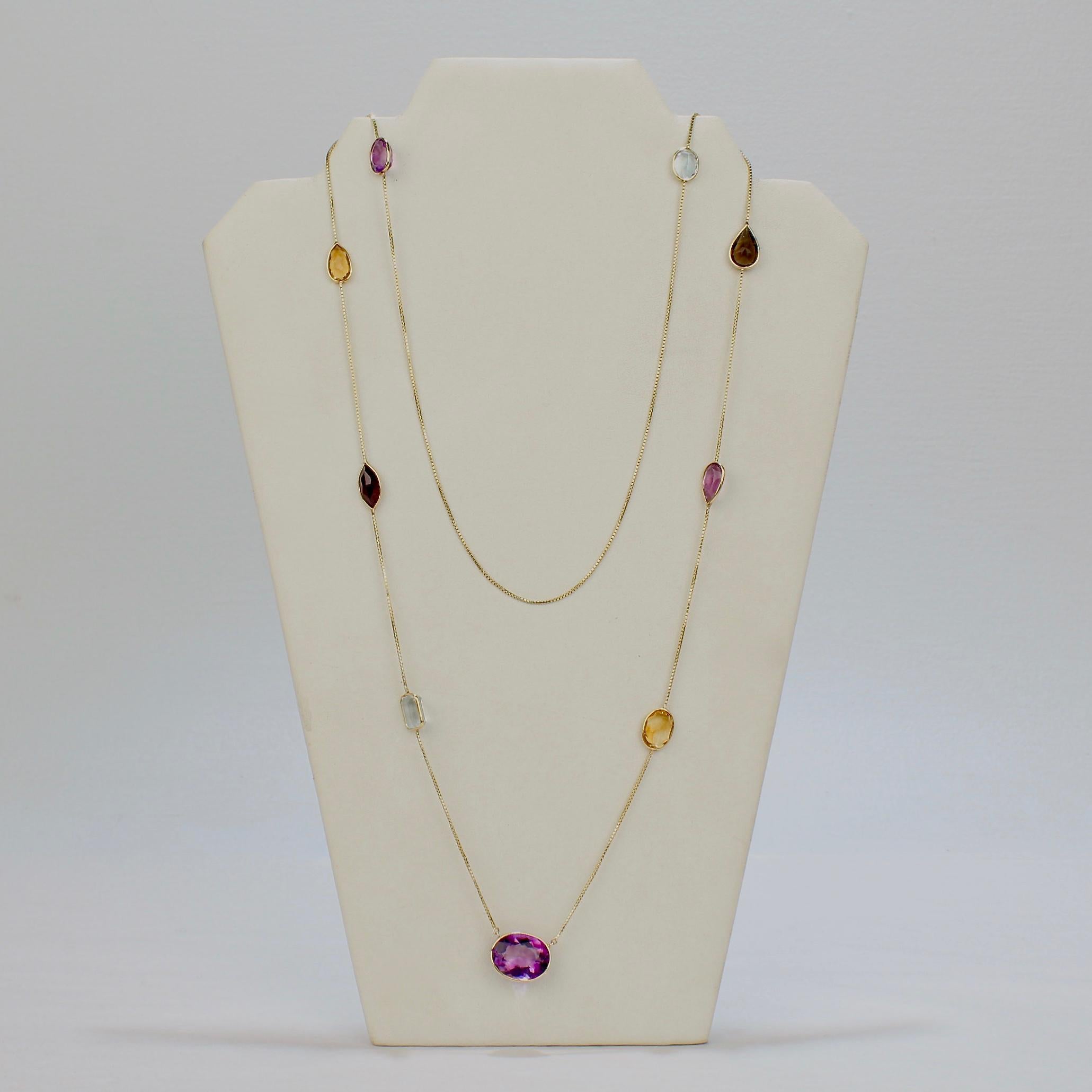 A fine Mid-century rope-length gold and gemstone necklace.

With a box chain in 14k yellow gold supporting bezel-set, pear and oval cut amethyst, topaz, and citrine gemstones. 

A great necklace that can be worn at full rope length or elegantly