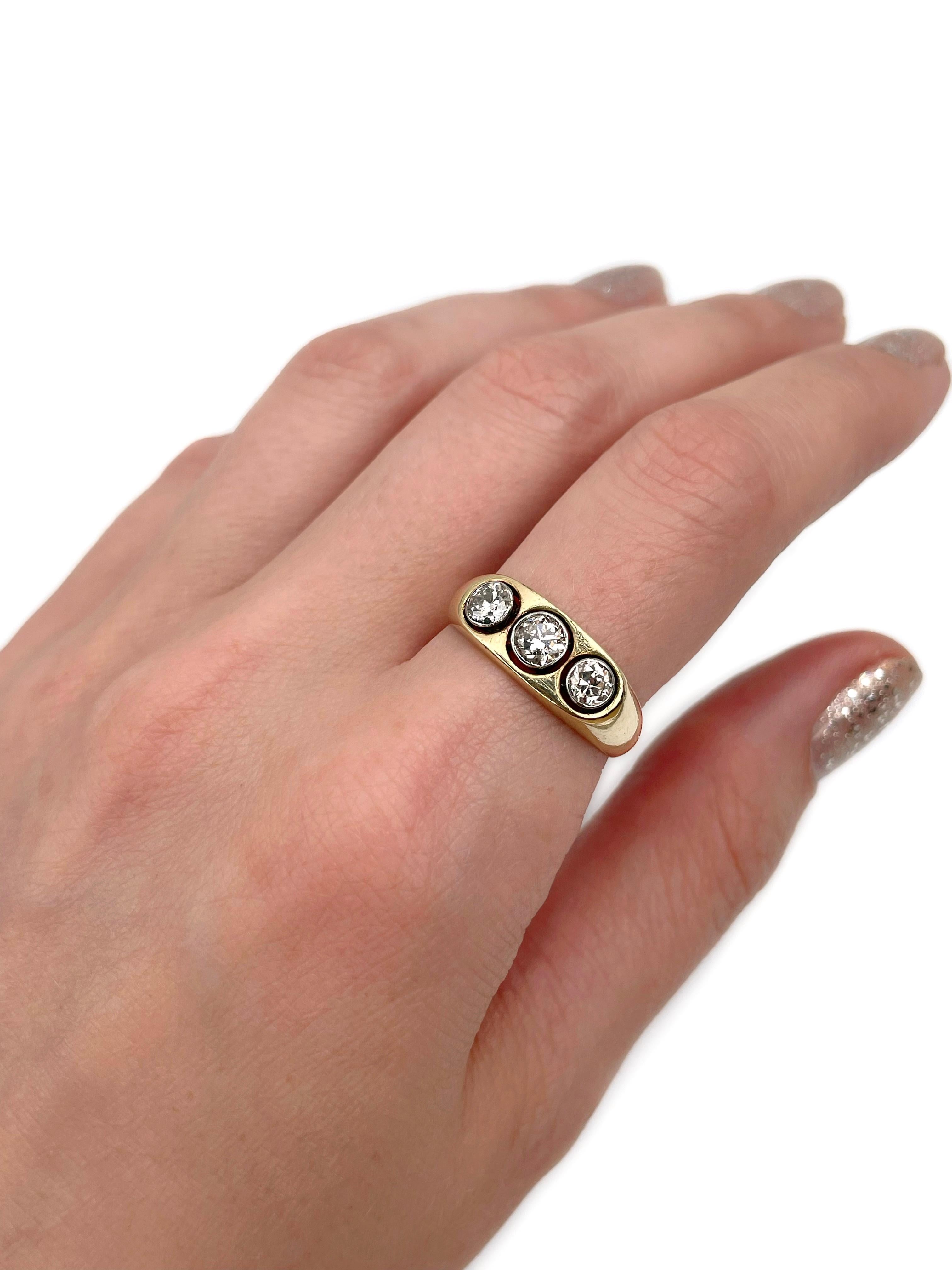 This is a three-stone ring crafted in 14K gold. Circa 1950.  

The piece features 3 diamonds: antique cut, TW 0.70ct, W-STW, P1-P2.

Weight: 5.43g
Size: 18.25 (US 8)

IMPORTANT: please ask about the possibility to resize before purchase. This