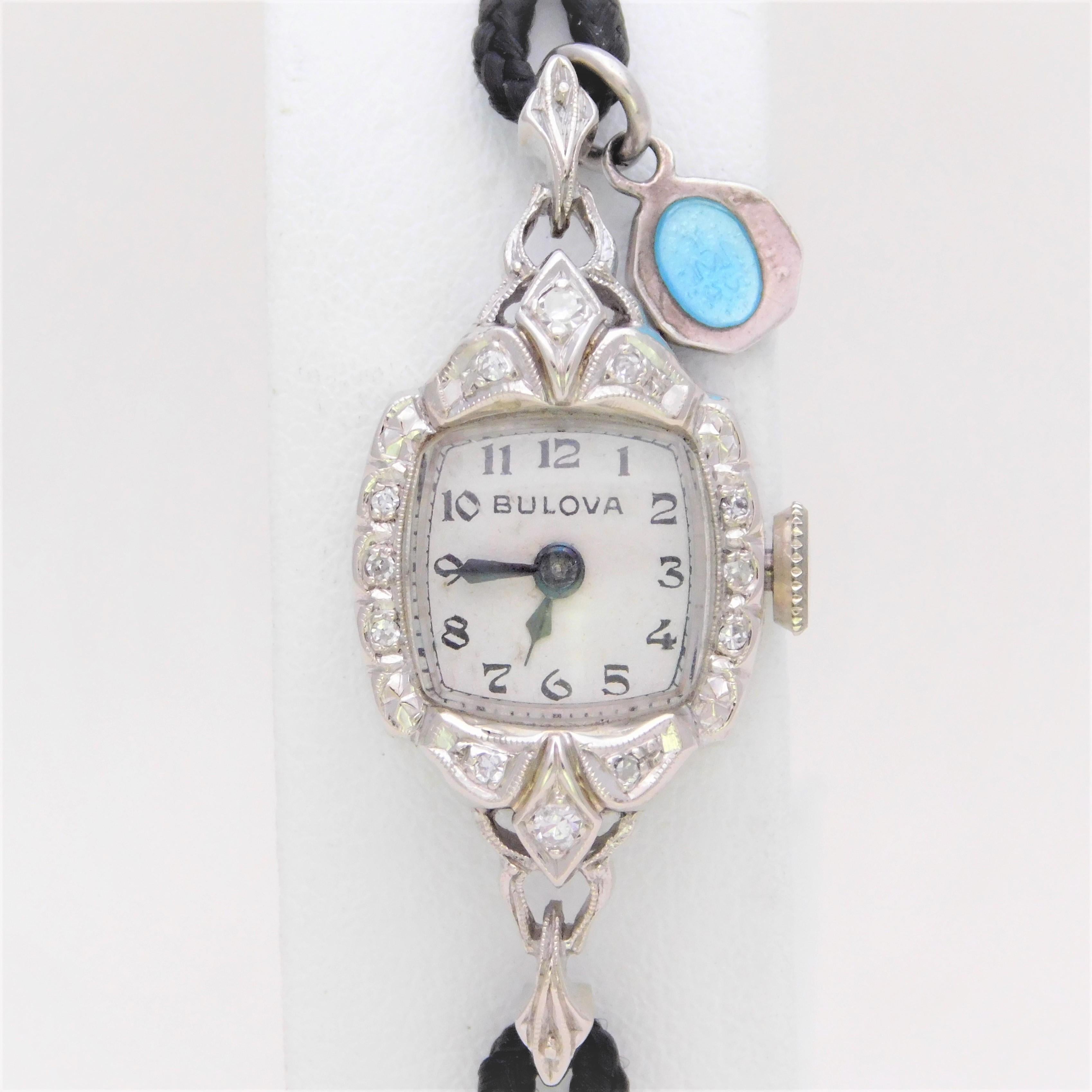 From a lovely Southern Estate.  Circa 1940s.  This charming early Mid-Century Ladies timepiece has been crafted in solid 14k white gold.  It has been jeweled with a total of 12 natural round single-cut diamonds approximating 0.10ct in total diamond