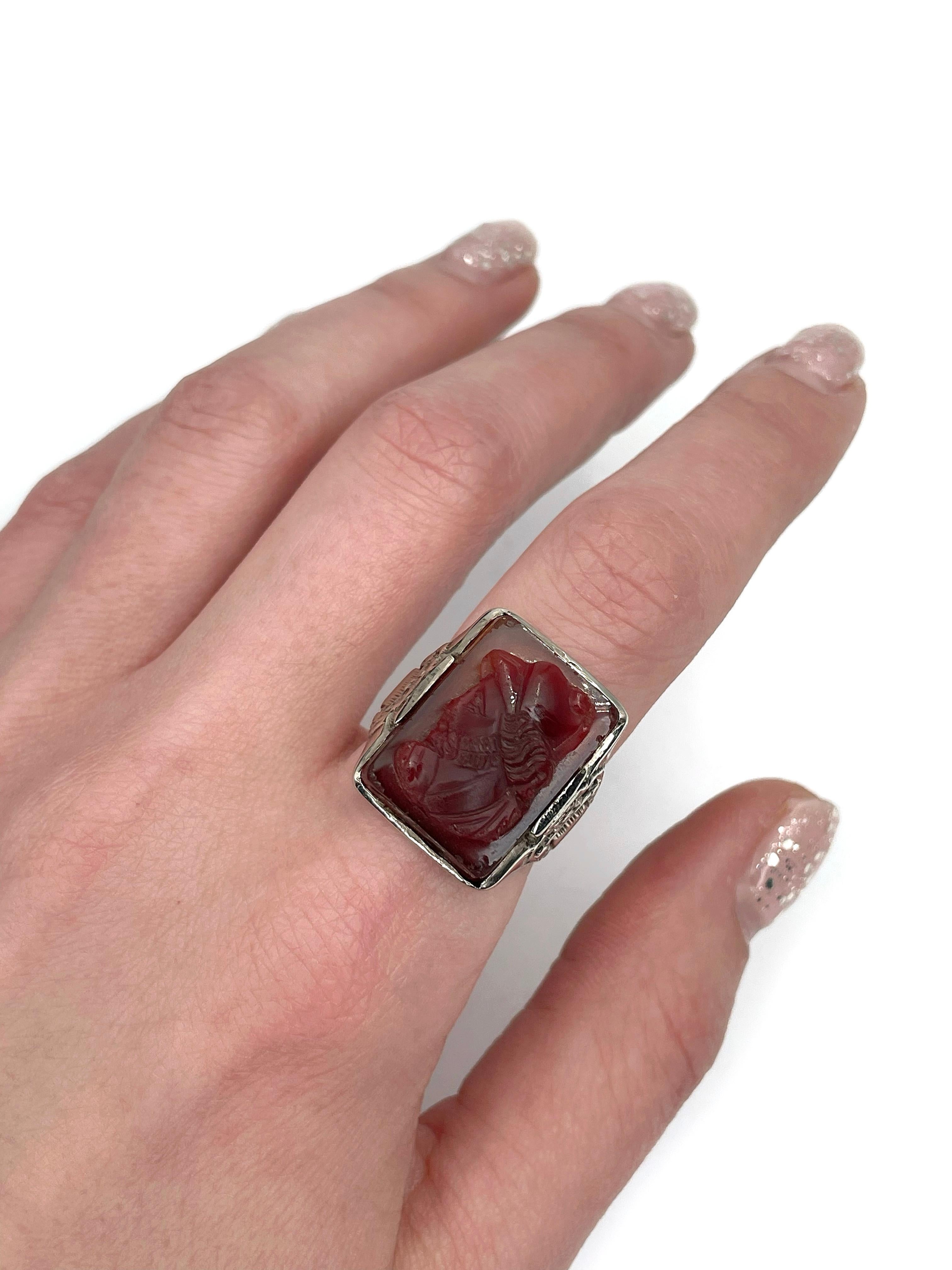 This is a massive rectangle signet ring crafted in 14K white gold. The piece features carved carnelian depicting a man with a beard.

Weight: 12.36g
Size: 18 (US 8)

IMPORTANT: please ask about the possibility to resize before purchase. This process
