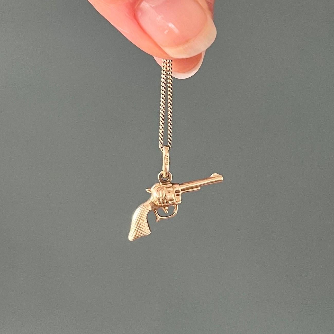 A vintage gold pistol charm pendant. The charm pistol is nicely detailed and created in 14 karat yellow gold. Charms are great to collect as wearable memories, it has a symbolic and often a sentimental value. They can be added to your necklace,