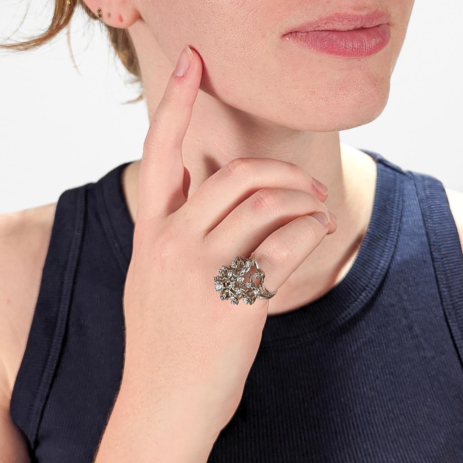 A fine Mid-Century ring.

In 14K white gold.

In form of a stylized harem (or Christmas tree) ring.

Set with a round ca. 4mm diamond to its peak and having three concentric tiers each set with a series of round cut diamond.

Simply an wonderful