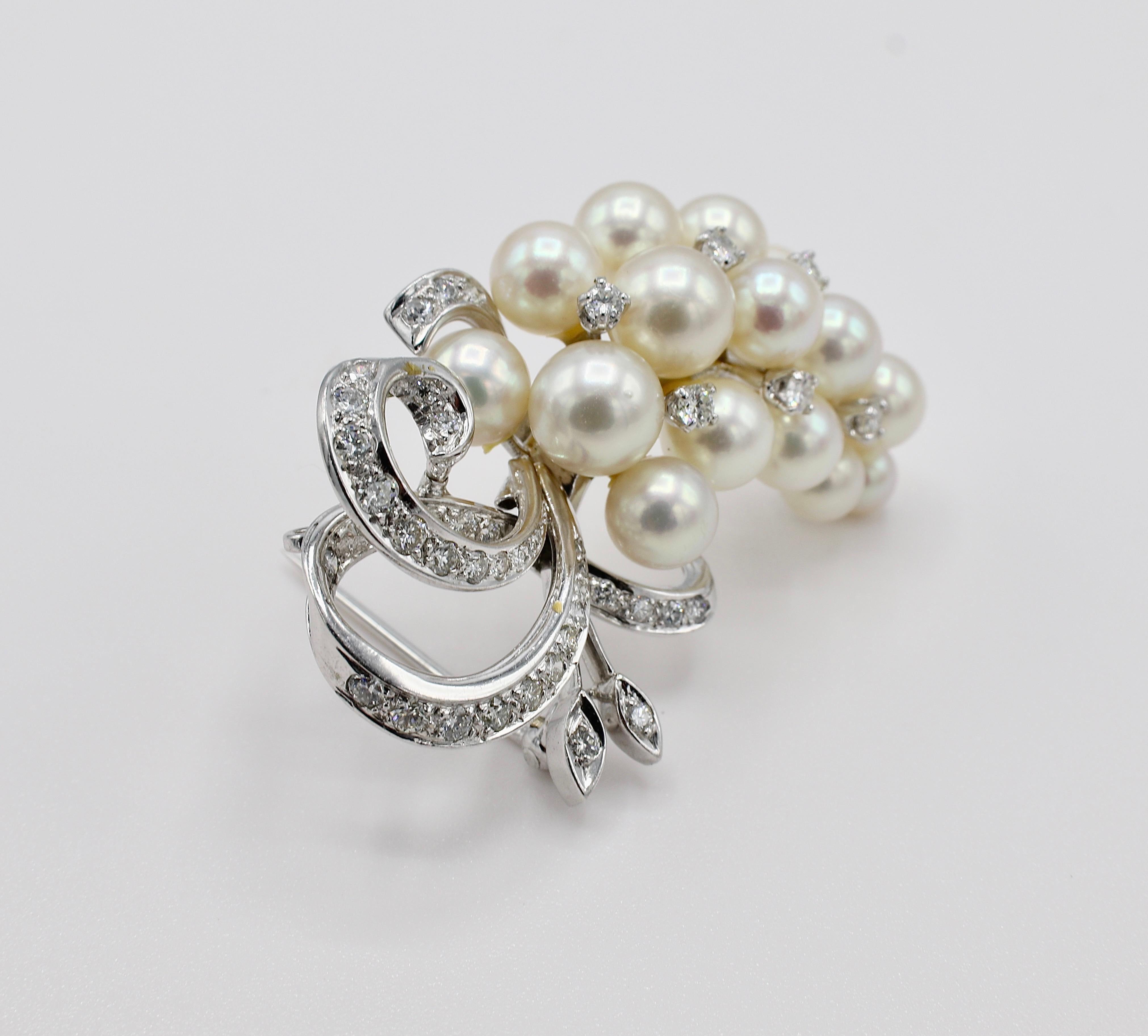 14K White Gold Pearl & Diamond Cluster Pin Brooch

Metal: 14k white gold
Weight: 15.5 grams
Length: 47.5mm
Width: 32mm
Diamonds: Approx. 1.40 CTW G-H VS
Pearls: 4.5 - 8mm