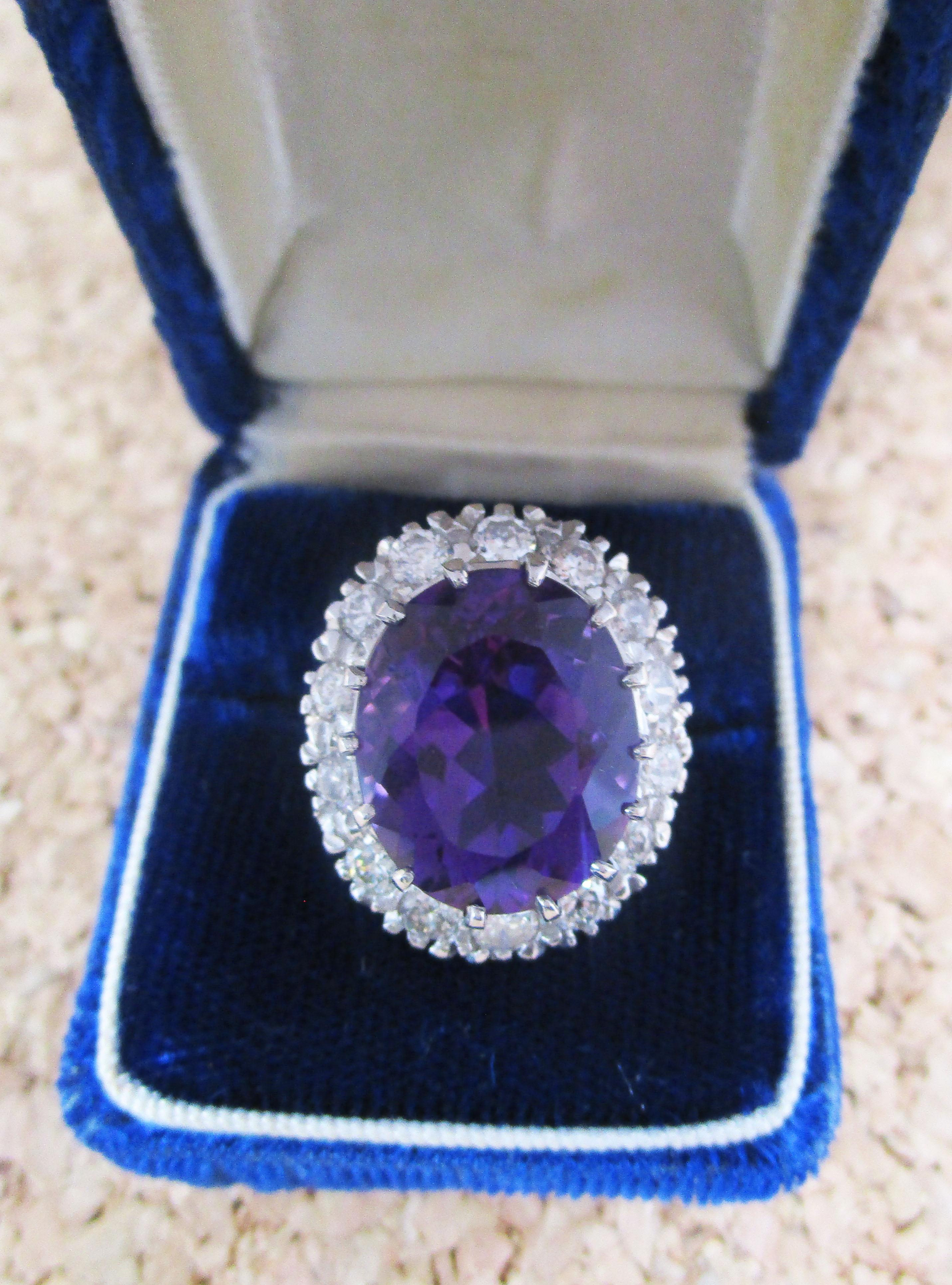 This killer ring is a stunning mid-century design in 14k yellow gold and platinum with a drop-dead gorgeous amethyst center stone framed by brilliant white diamonds. This ring is not one to go unseen-this is a ring for the woman who wants to be