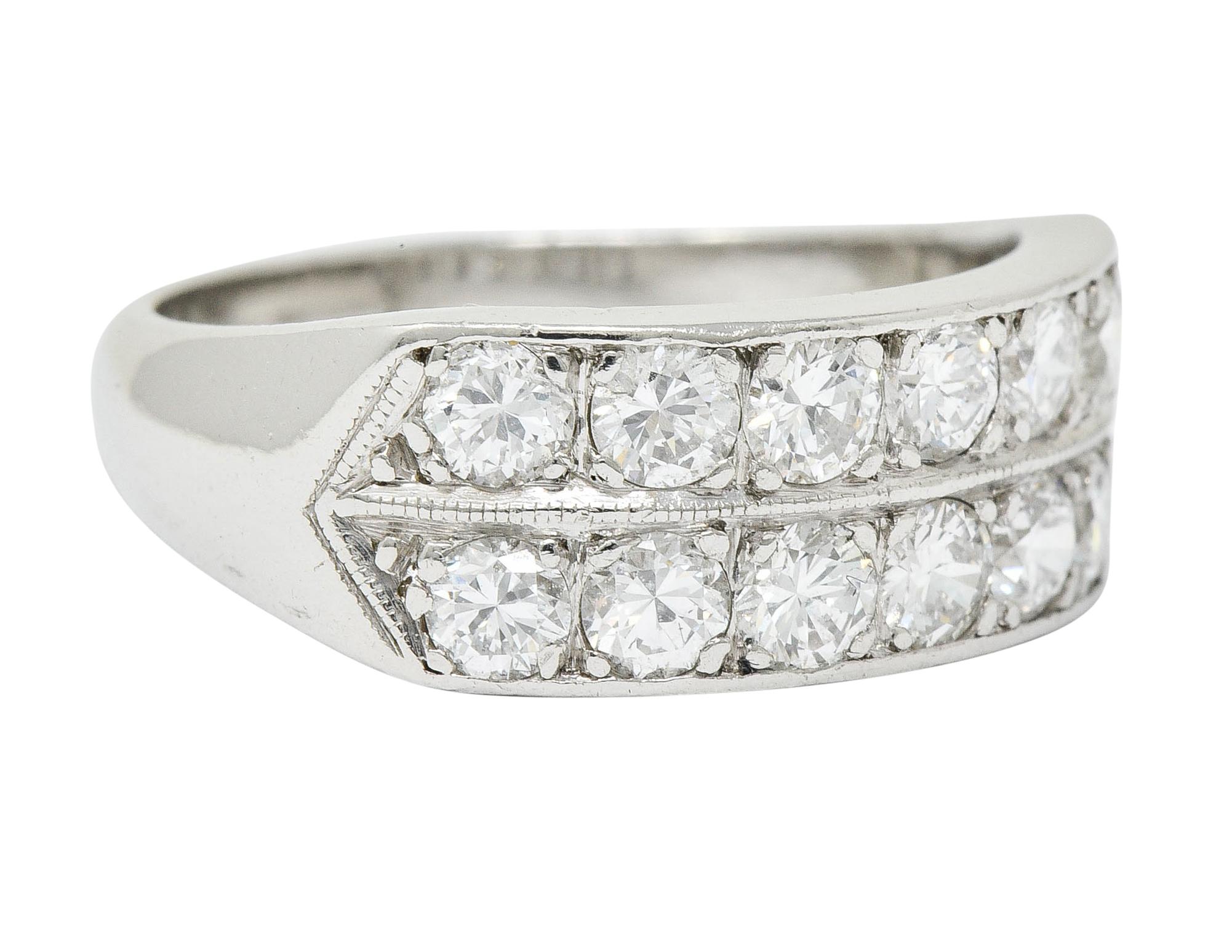 Band ring designed with two rows of diamonds, East to West

Round brilliant cut diamonds weigh in total approximately 1.50 carats; G to I color with VS clarity

Completed by slight milgrain and pointed shoulders

Stamped Plat for platinum

Circa: