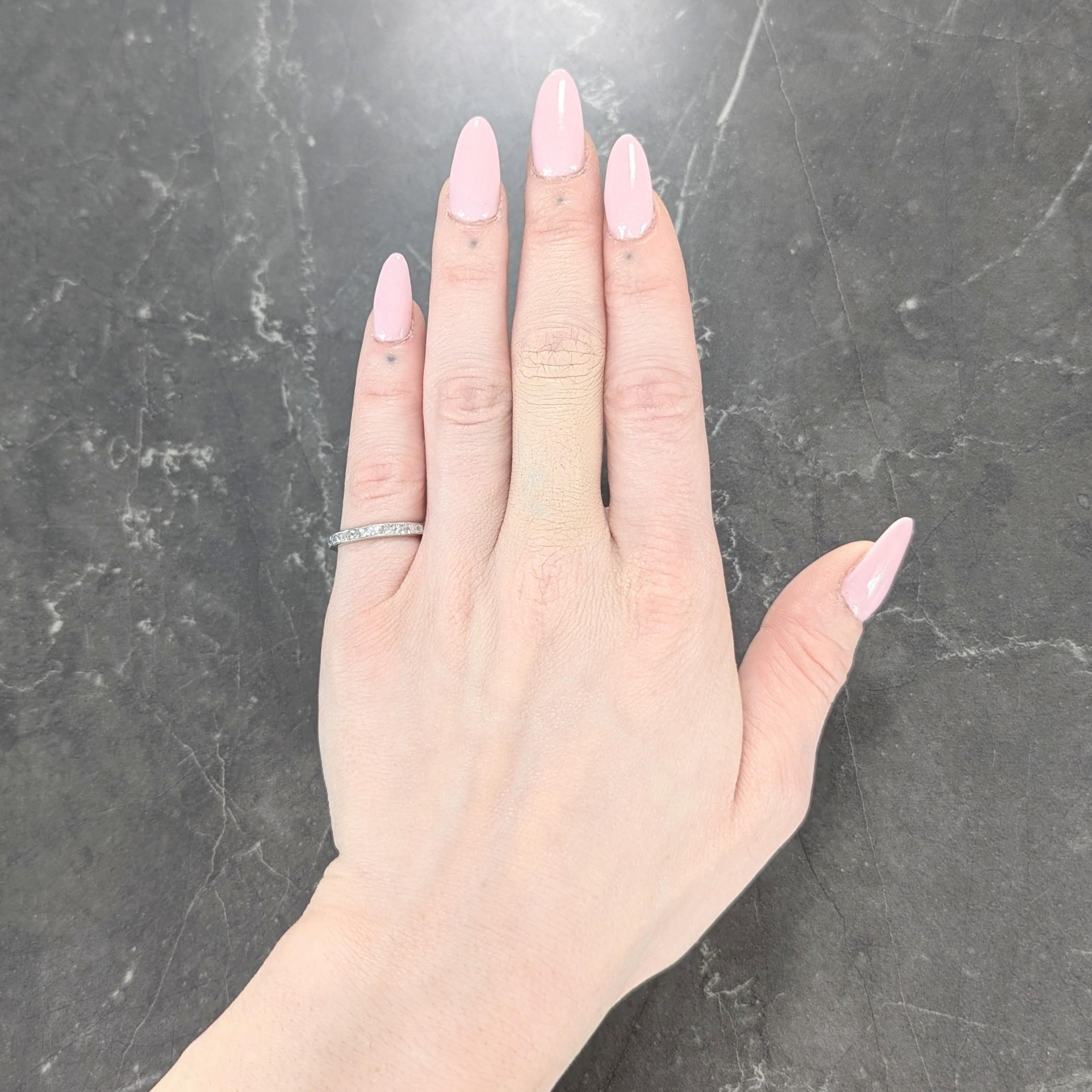 Featuring French cut diamonds channel set fully around
Weighing approximately 1.50 carats total
H color with VS2 clarity
Tested as platinum
Circa: 1950s
Ring Size: 5 and not sizable
Measures north to south 2.5 mm and sits 1.5 mm high
Total Weight: