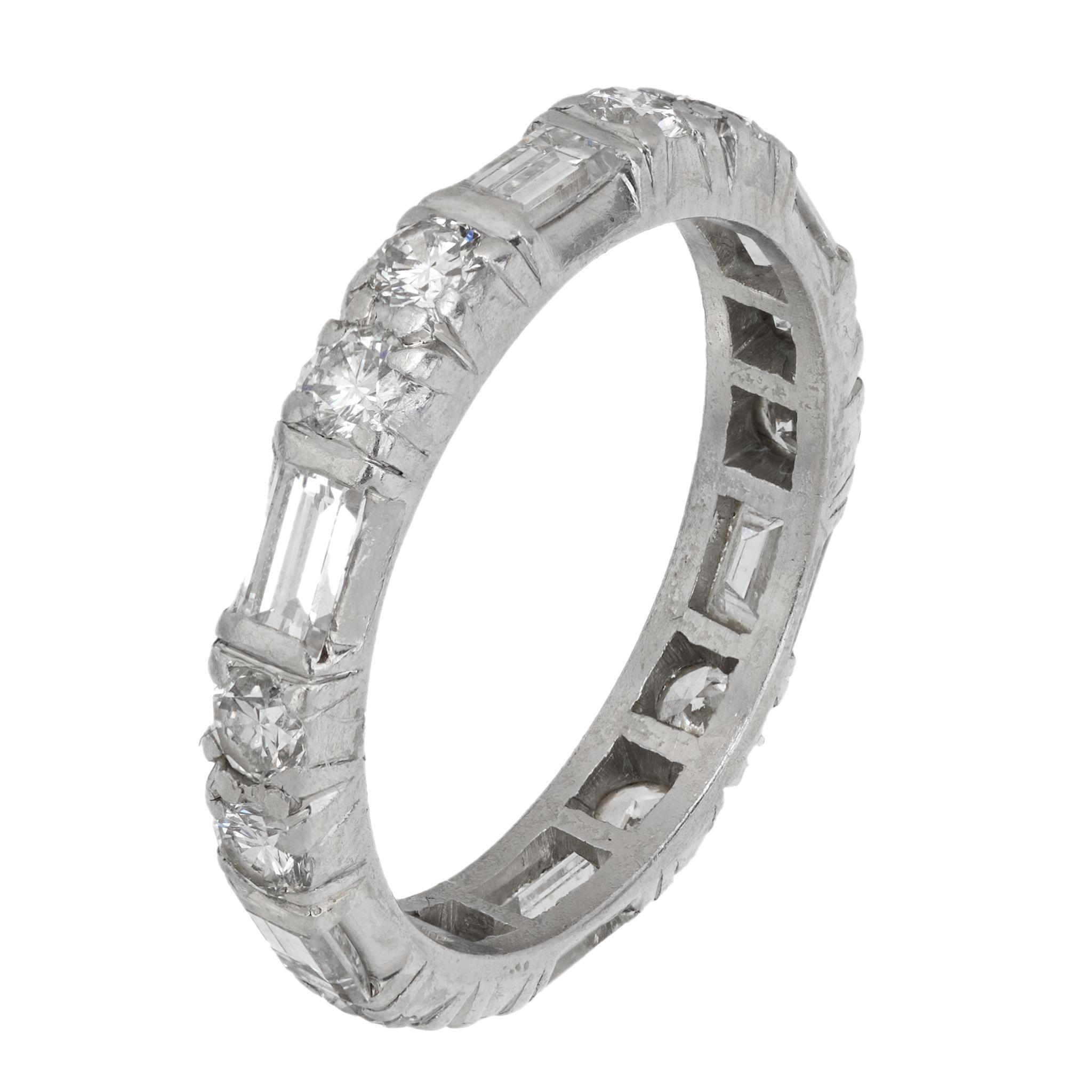 Baguette Cut Mid Century 1.60 carat baguette and round brilliant cut diamond platinum ring