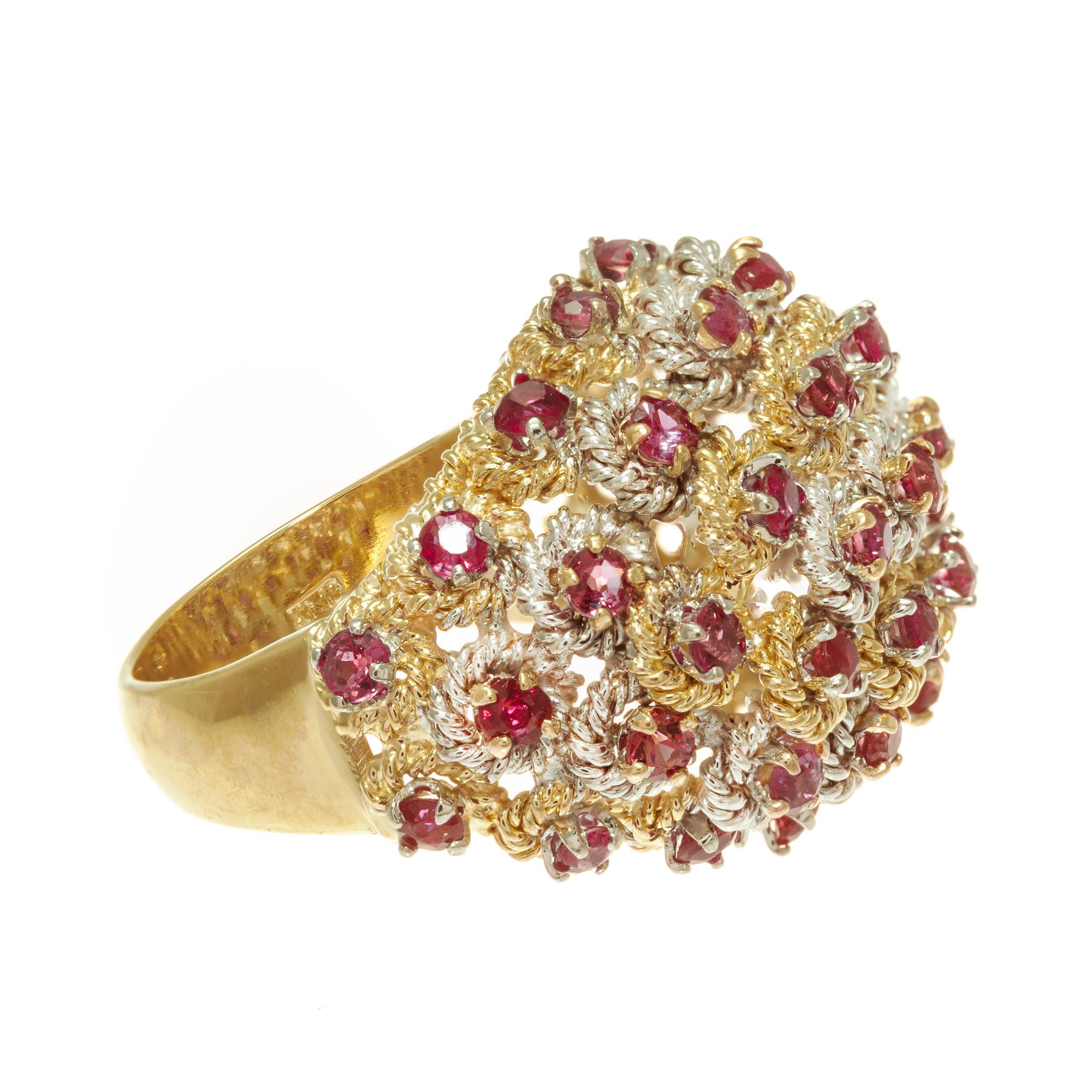 Mid-century round ruby twisted wire design domed cocktail ring set in 18k yellow and white gold. 43 round rubies. 

43 round red rubies Approx. Total Weight  1.70cts 
Size 5.5 and sizable 
18k yellow gold 
18k white gold 
Stamped: KT 18
13.3