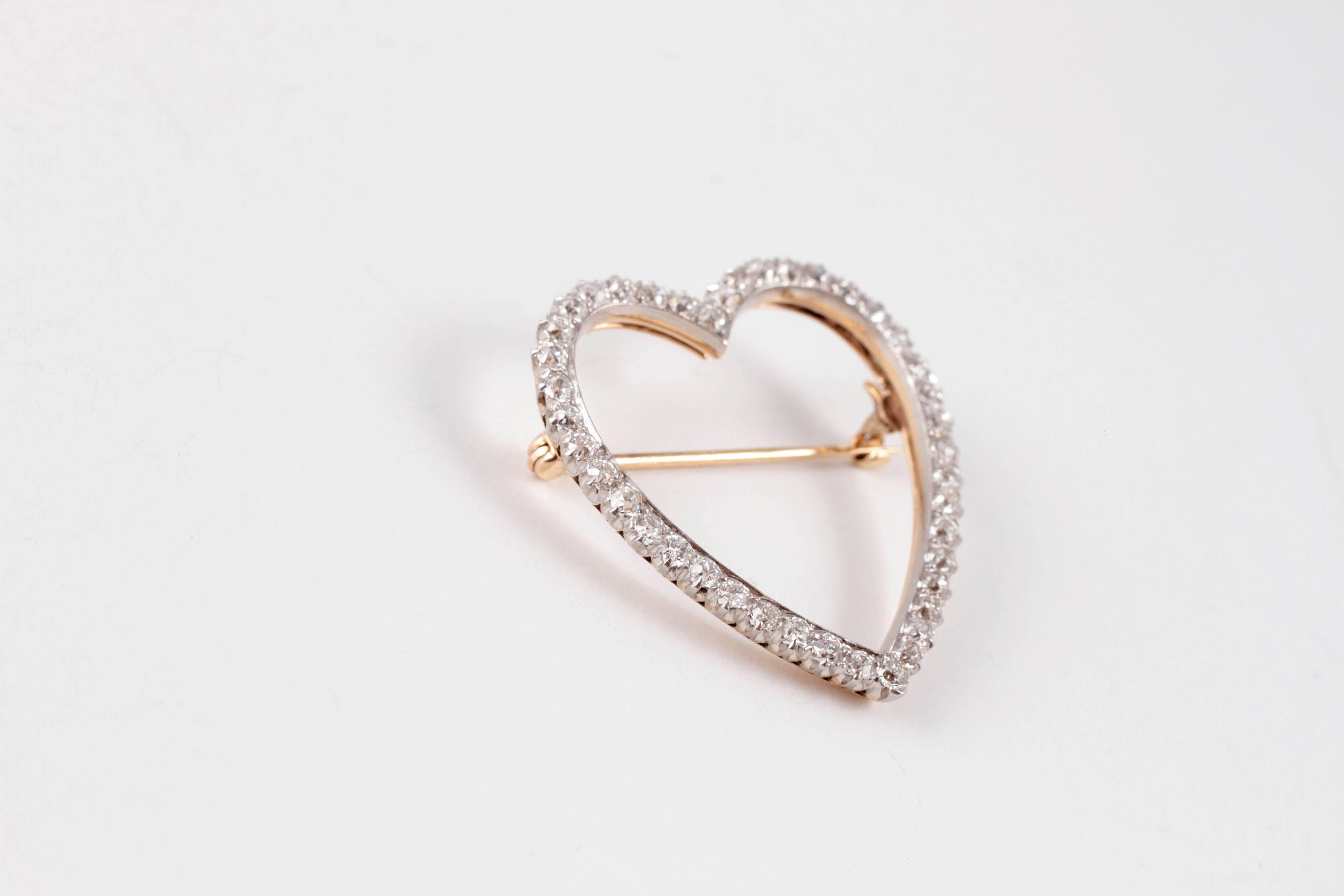 This light and lovely brooch would look beautiful on a blouse, scarf or in your hair!  Composed of 18 karat yellow and white gold in a heart shape, supporting 1.70 carats of diamonds.