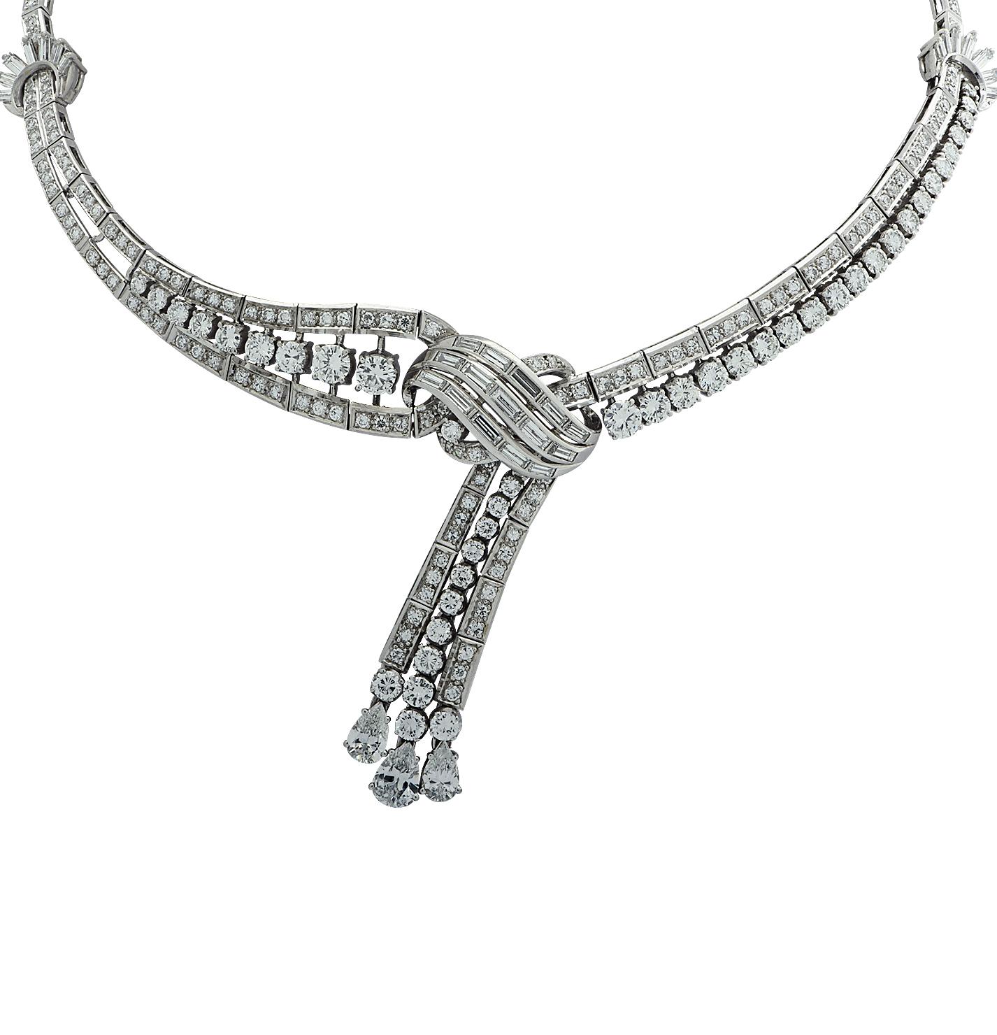 Mid Century diamond necklace crafted in Platinum, featuring round brilliant cut diamonds, pear shape diamonds and baguette cut diamonds weighing approximately 18.00 carats total, F-H color, VS clarity. Channel set round brilliant cut diamond station