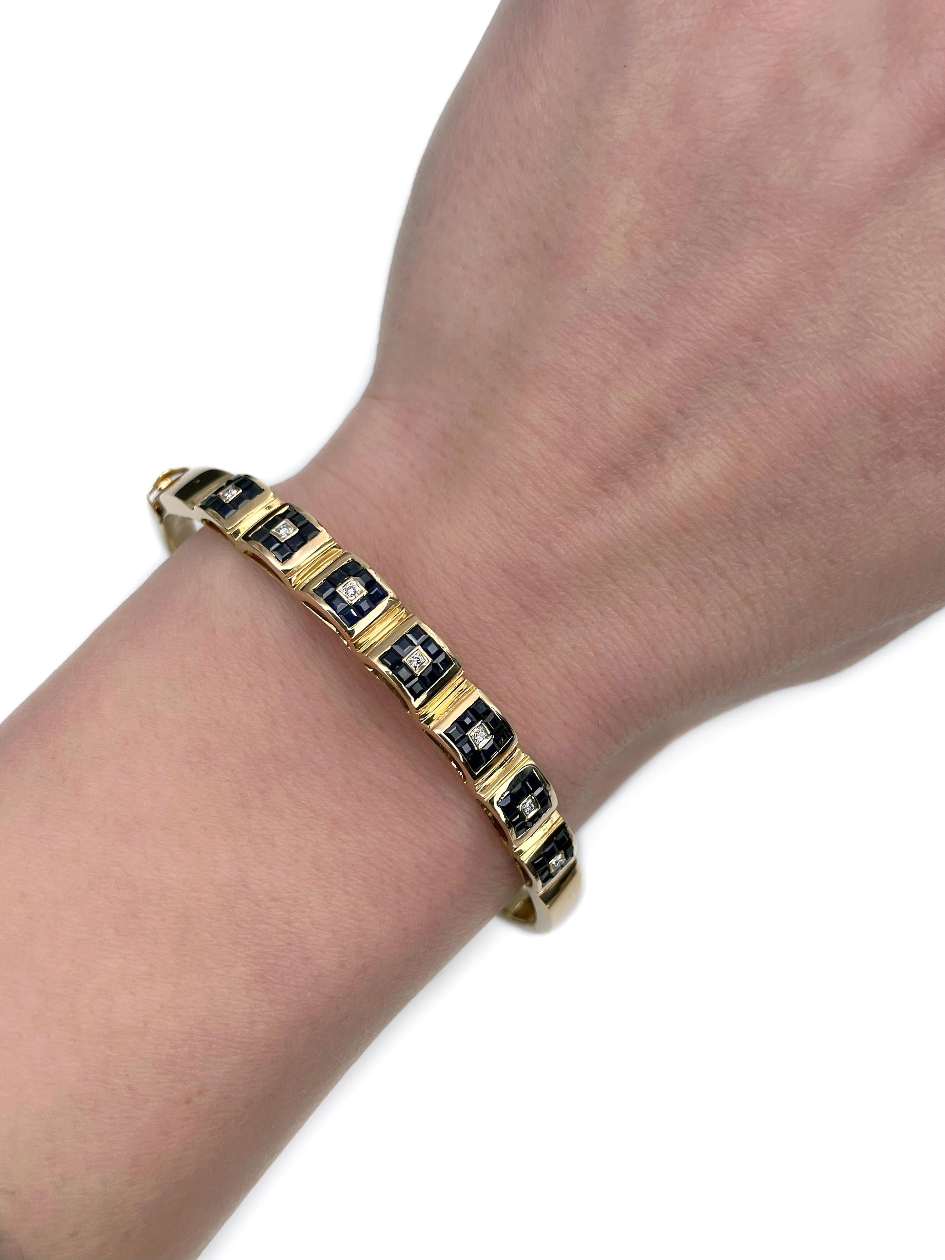 This is a Mid Century hinged bangle bracelet crafted in 18K yellow gold. Circa 1970. 

The piece features:
- 56 sapphires, square step cut, TW 1.40ct, B 7/4-7/5, VS-SI
- 7 diamonds, brilliant cut, TW 0.035ct, RW-W, VS-SI

Weight: 23.14g
Inner