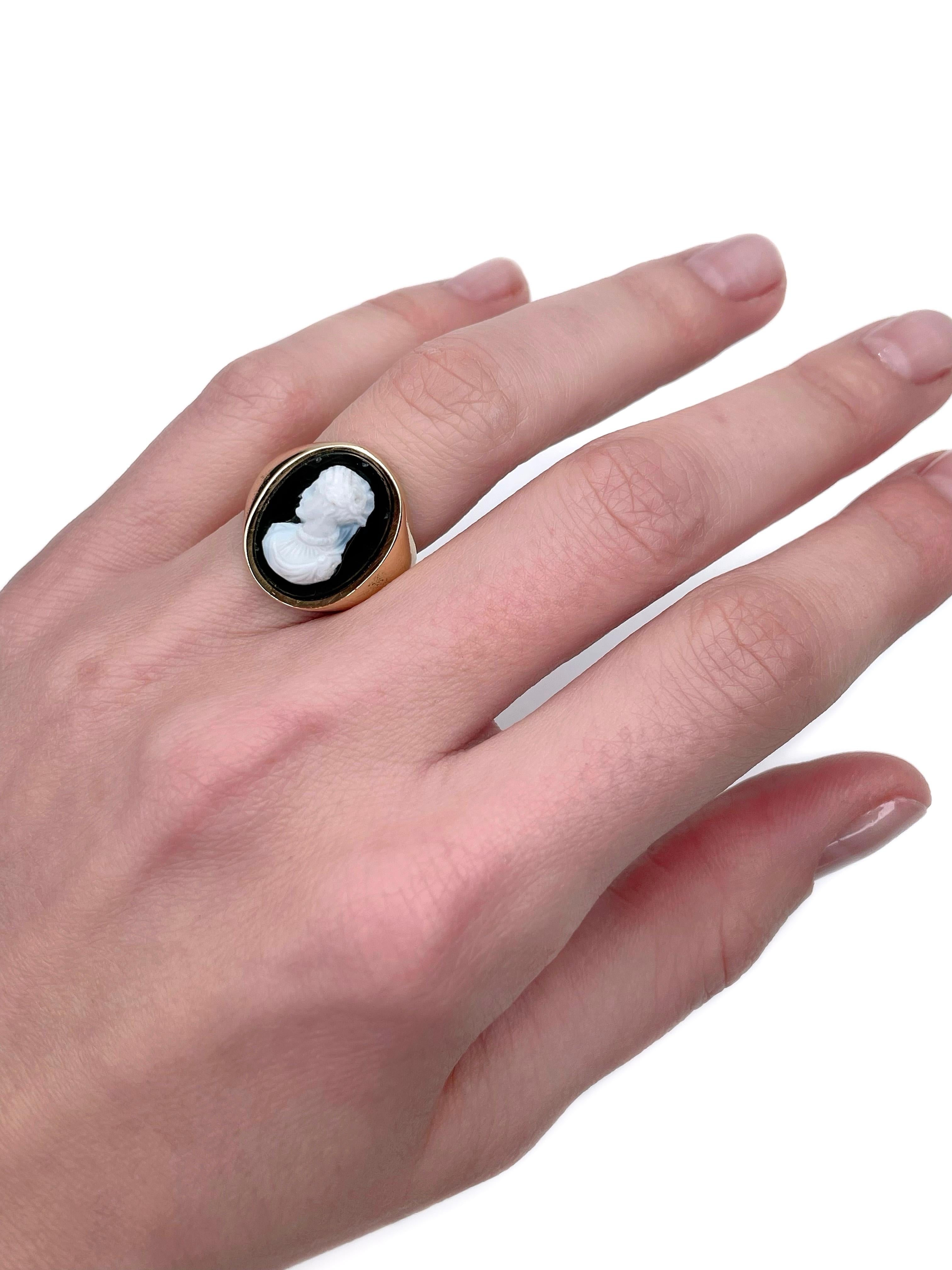 This is a vintage cocktail ring crafted in 18K gold. Circa 1960. 

It features an onyx cameo depicting a lady facing left. This is rare and valuable, because the majority of cameos face right.  

Weight: 8.87g
Size: 15.75 (US 5.25)

IMPORTANT:
