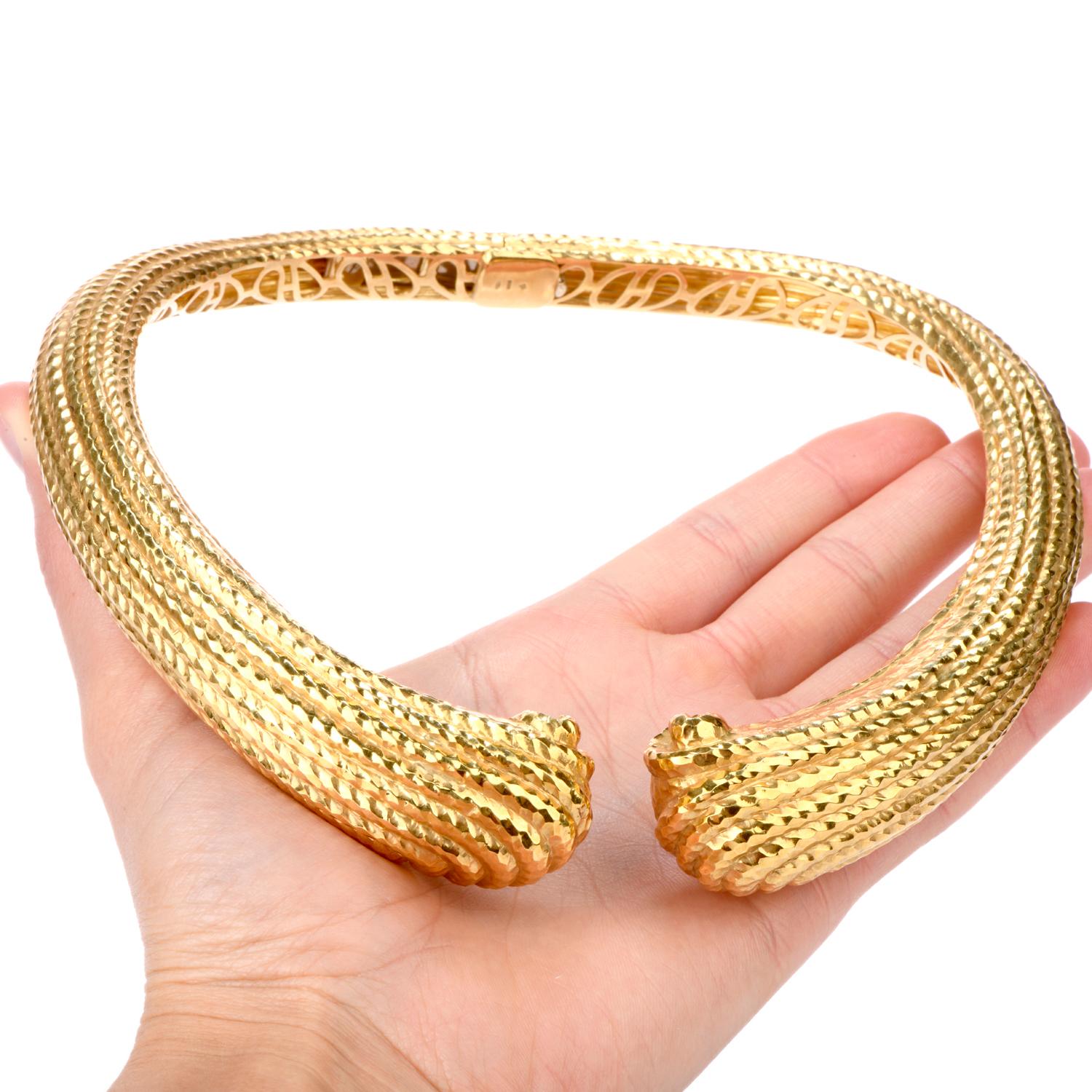 This incredible 18 Karat yellow gold Vintage early 1980's Collar Necklace was inspired in shell motif. The ribbing of the shell design boasts a high polished Hand hammered effect creating depth and interest. The center of the collar is hinged for