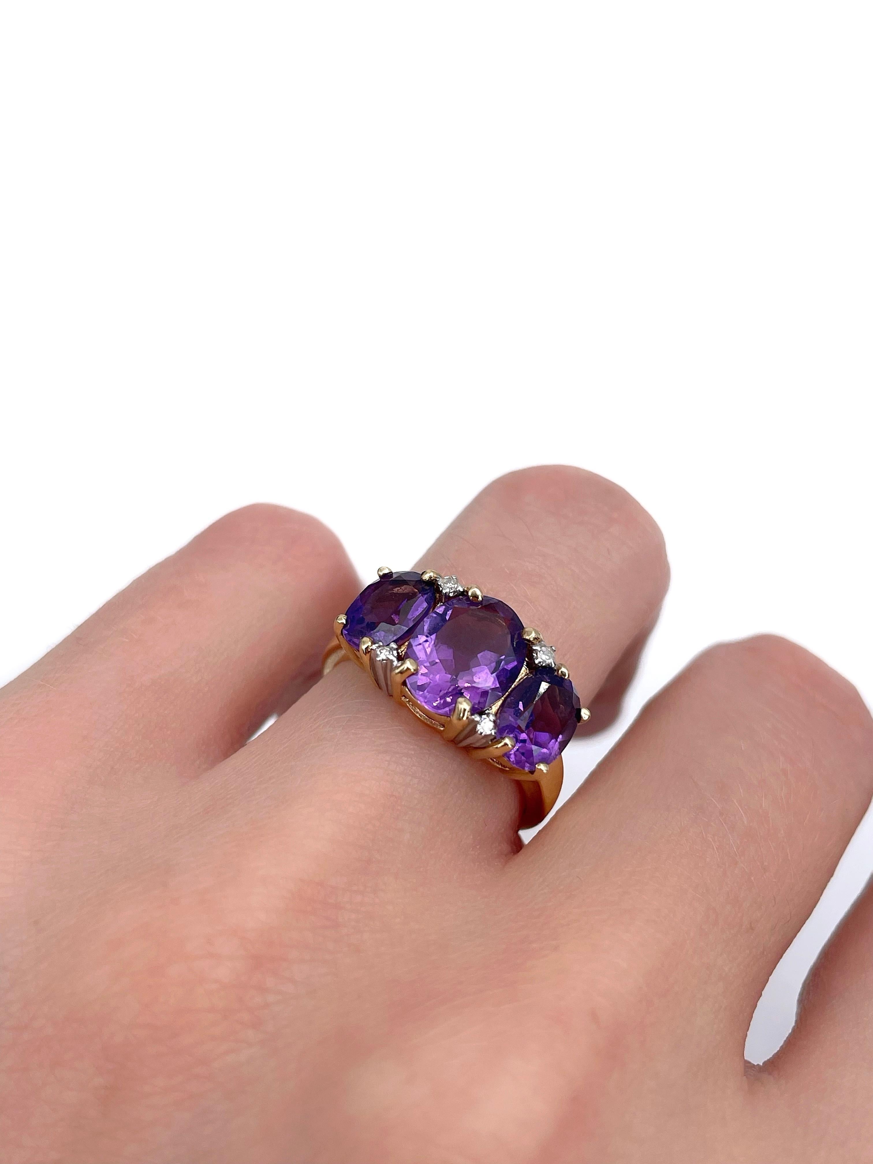 This is a lovely three-stone ring crafted in 18K yellow gold. Circa 1960. 

The piece features 3 oval cut amazing colour amethysts. The gems are accompanied with 4 tiny diamonds. 

Weight: 3.61g
Size: 16.5 (US 6)

IMPORTANT: please ask about the