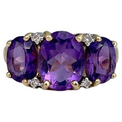 Vintage Mid Century 18 Karat Yellow Gold Amethyst Diamond Three-Stone Ring