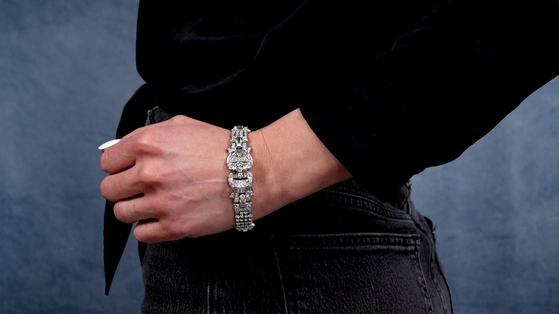 One Mid-Century 18.60 Carat Total Weight Diamond Platinum Bracelet. Featuring 30 baguette cut and 207 round brilliant and transitional cut diamonds with a total weight of approximately 18.60 carats, graded colorless, VS clarity. Crafted in platinum.