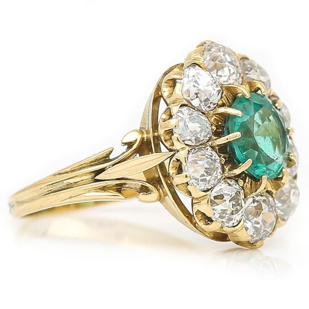 Midcentury 18ct Gold 2.7ct Emerald and 3.2ct Old Cut Diamond Cluster Ring In Good Condition In Lancashire, Oldham