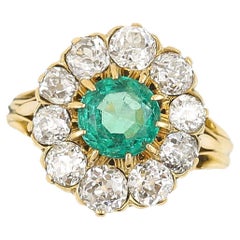 Midcentury 18ct Gold 2.7ct Emerald and 3.2ct Old Cut Diamond Cluster Ring