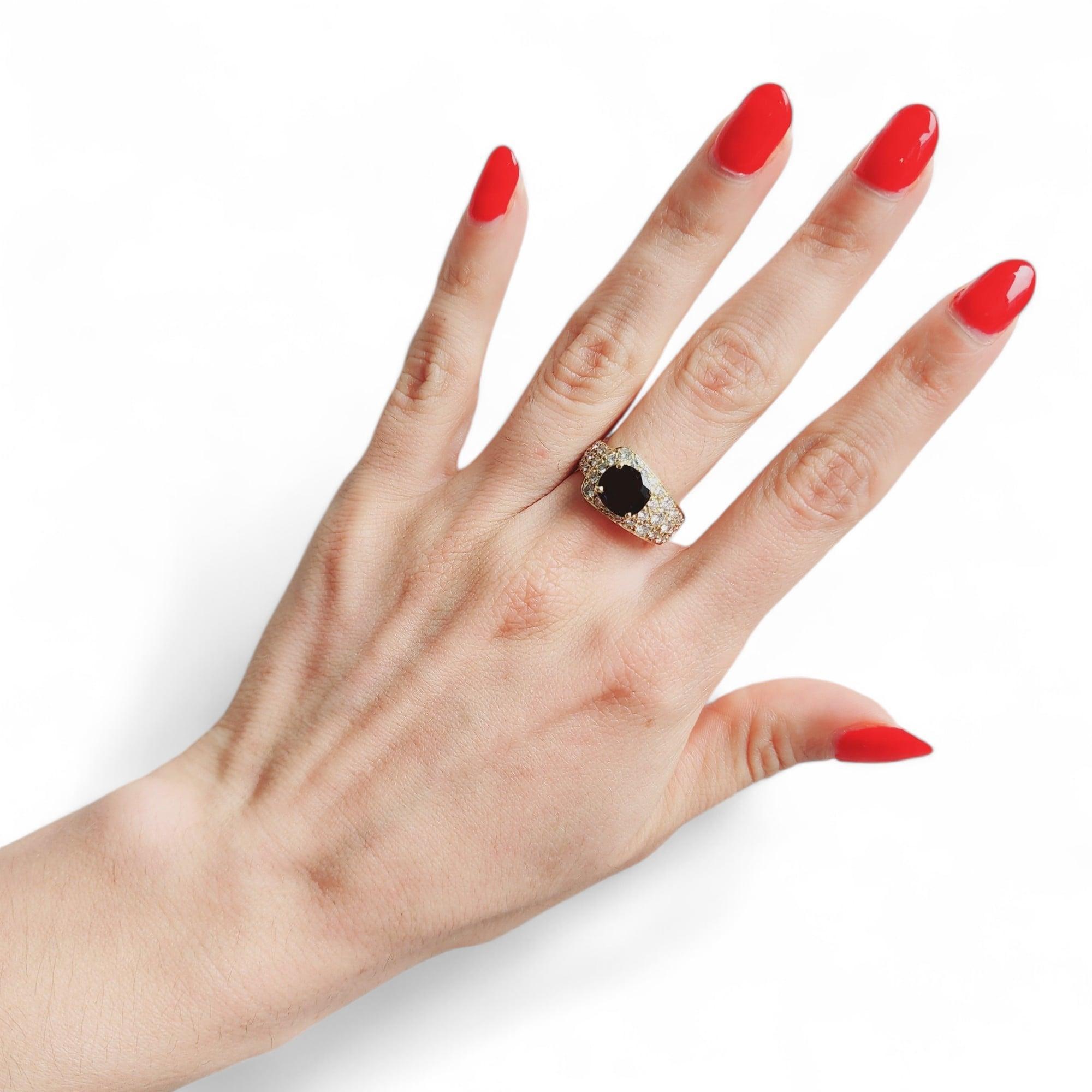 Nice Ring crafted in 18k yellow Gold featuring a center Oval shaped Sapphire approximately 1.50 carats. Accented with a pave of 45 calibrated Round cut Diamonds weighing approximately. 1.50 Carats. G-H color. VS1 Clarity. 

Indulge in the epitome of