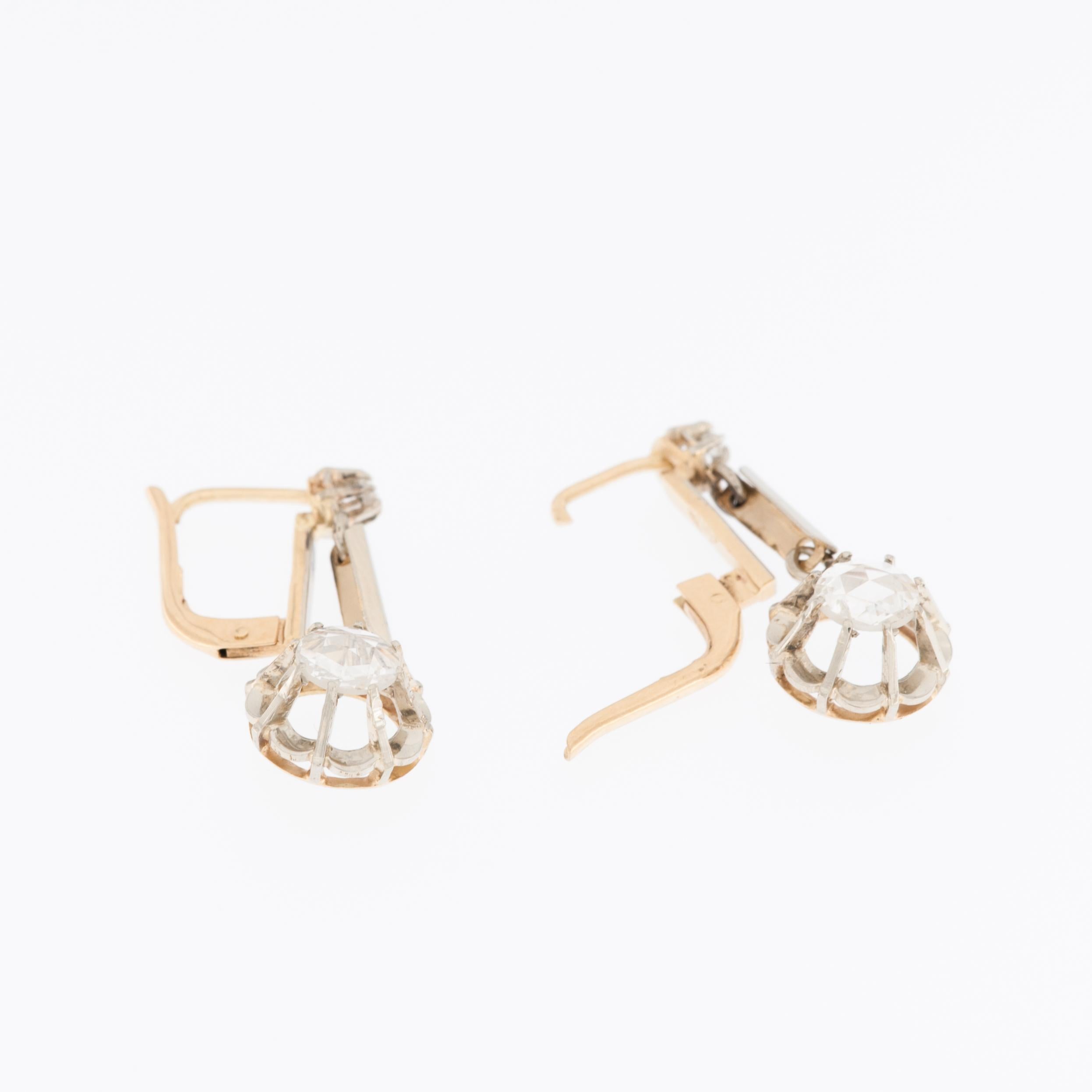 The Mid-Century 18kt Yellow Gold Earrings, are delicately crafted to embody the epitome of timeless elegance. The warm, buttery hue of the 18kt yellow gold sets the stage for a journey through the mid-20th century, capturing the essence of an era