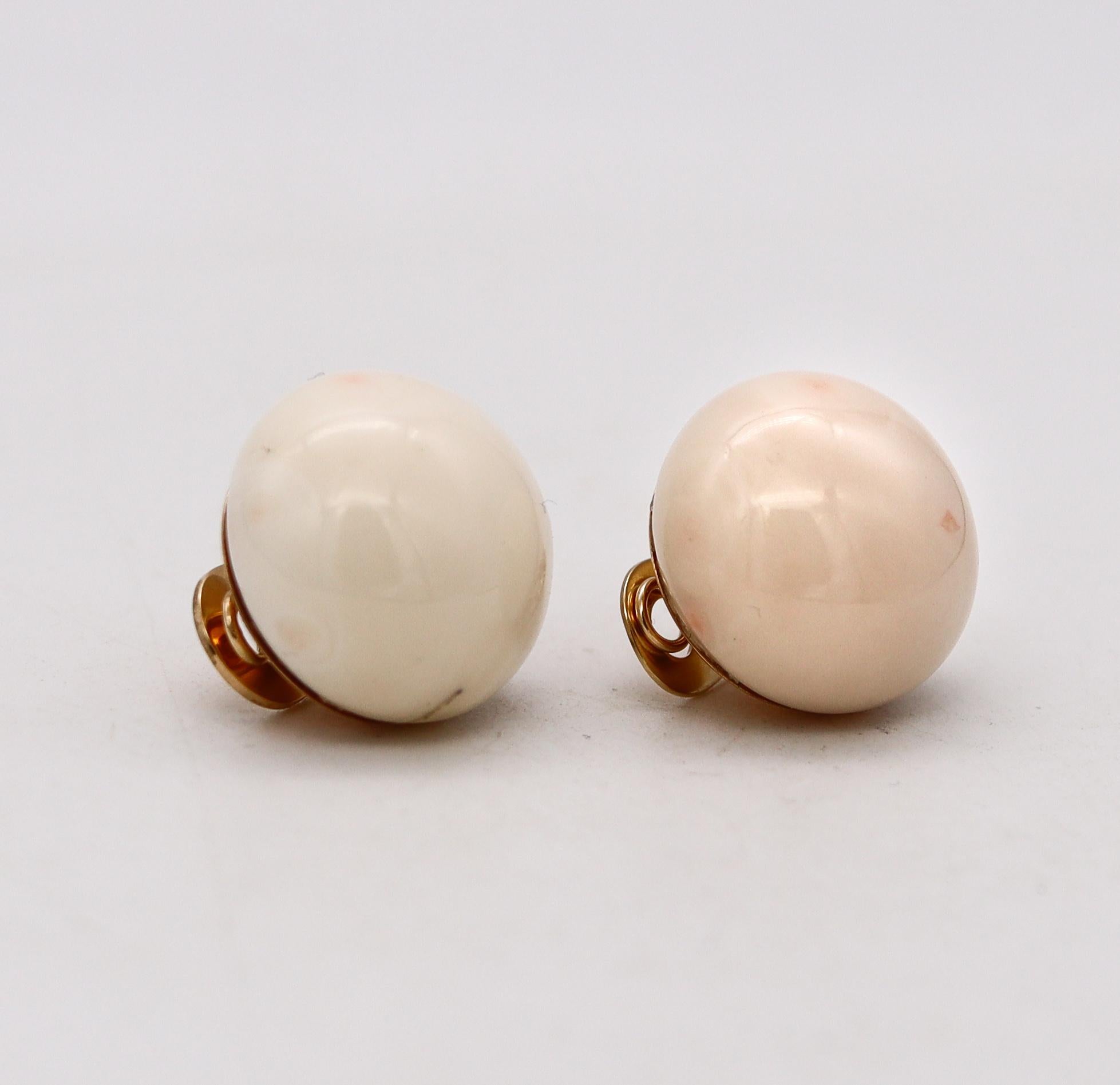 Button clips-earrings from the post-war period.

Beautiful and elegant pair of clips-earrings, created in the United States during the mid-century period, back in the 1950's. These pieces was crafted in solid yellow gold of 14 karats and mounted