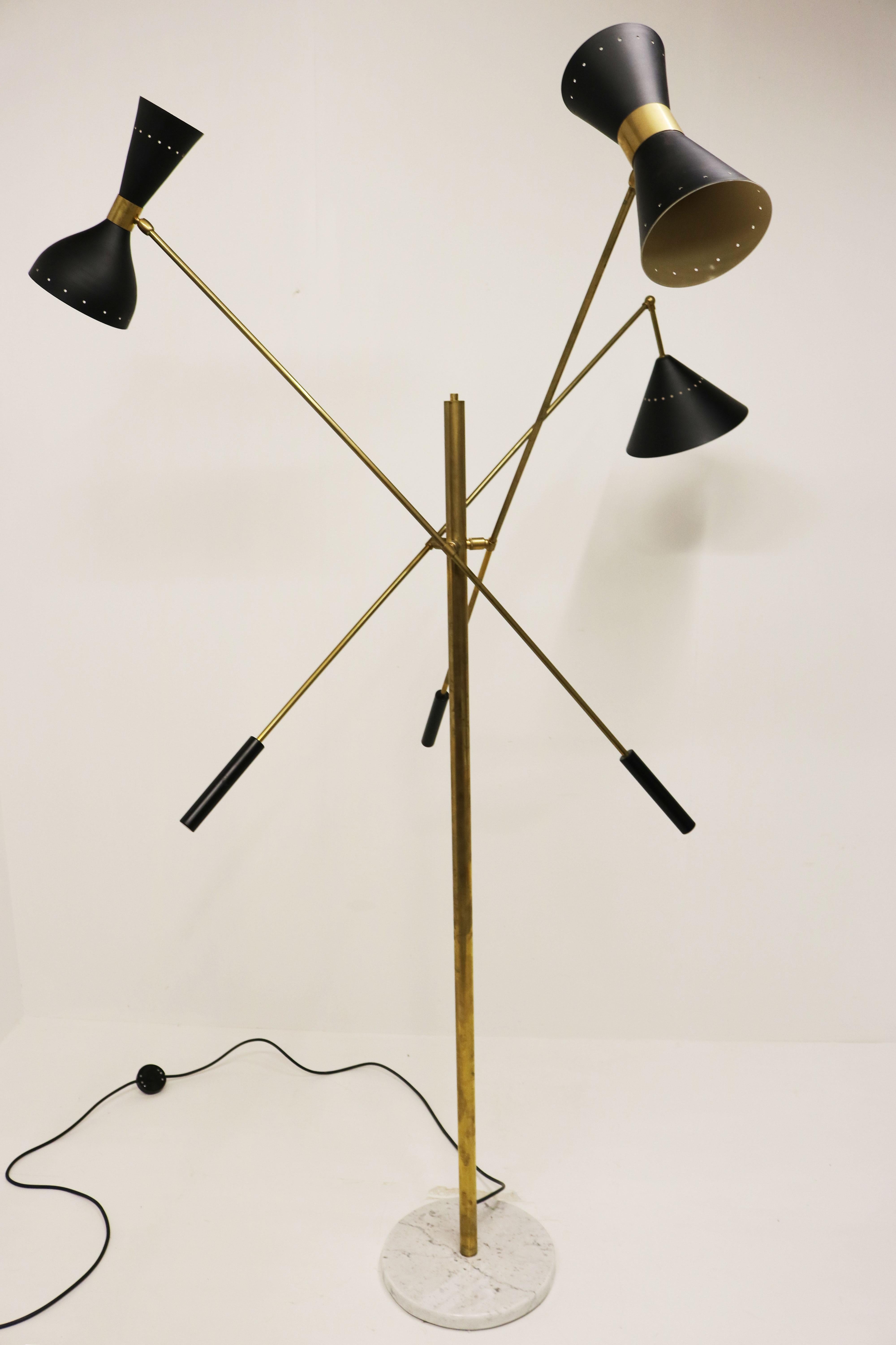 Stylish & timeless! This amazing Italian floor lamp in brass with 3 different black metal shades & Carrara marble base.
In the minimalist design style of Stilnovo 1950. 
The floor lamp has 5 light sockets divided over 3 adjustable arms. 
You can