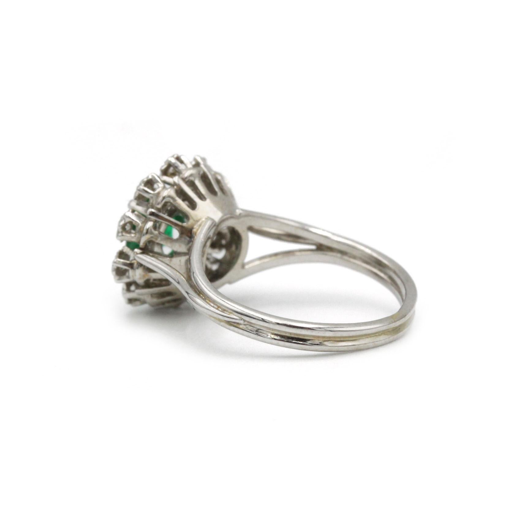 Emerald Cut Mid-Century 1950s 18K White Gold Daisy Halo Emerald & Diamond Cocktail Ring For Sale