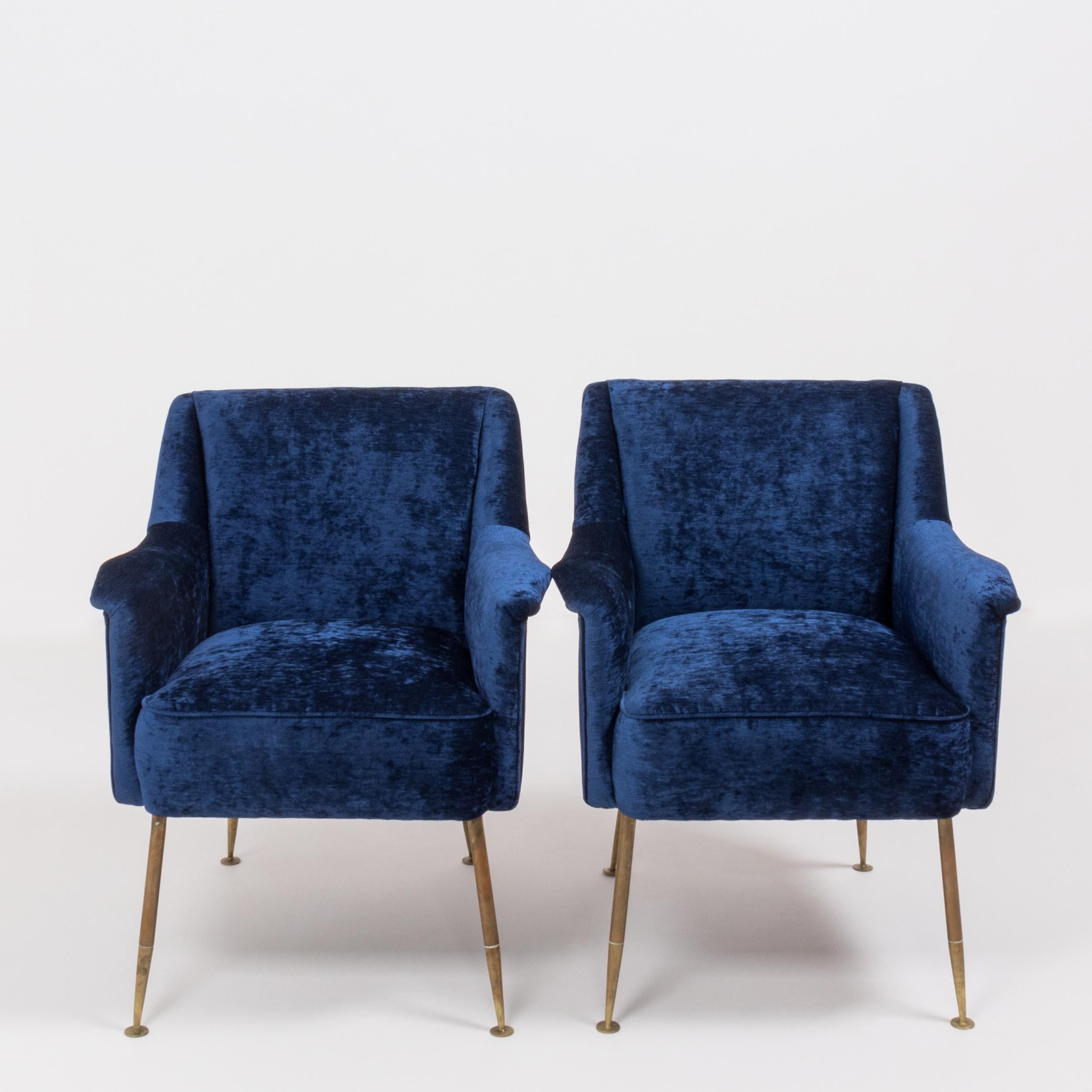 A beautifully designed pair of midcentury armchairs in blue velvet designed by Carlo Pagani

Camelia by Carlo Pagani, Italy, 1951.
Manufactured by Arflex. Reupholstered in sumptuous blue velvet, the chairs have deep, comfortable seats and brass