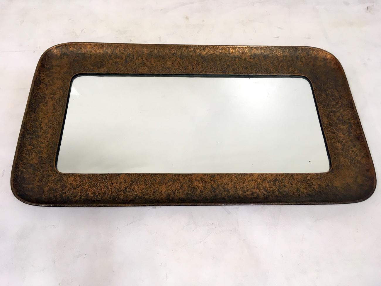 Console table and mirror
Wall hung table
By Angelo Bragalini
Copper,
1950s,
Italy
Mirror measures 51 x 89cm.