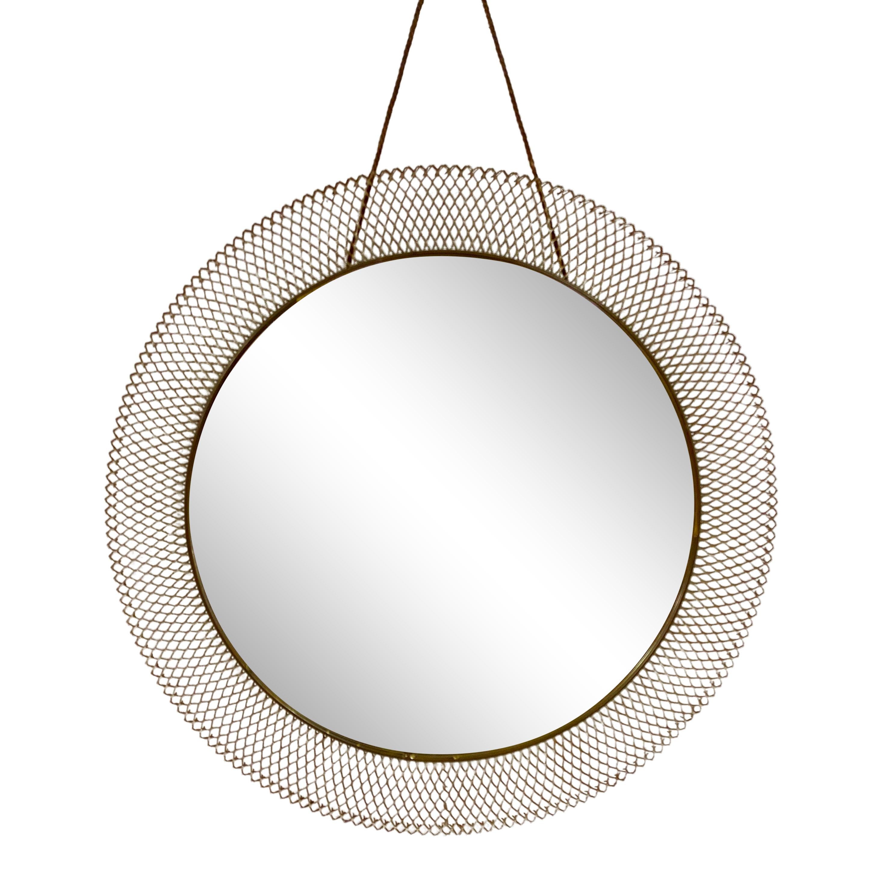 Circular mirror

Wire mesh frame

Brass banding

Italy, 1950s

Size: 45cm high with hanging rope.
    