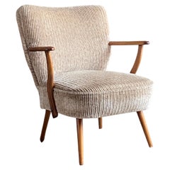 Mid century 1950's Scandinavian cocktail armchair with new upholstery