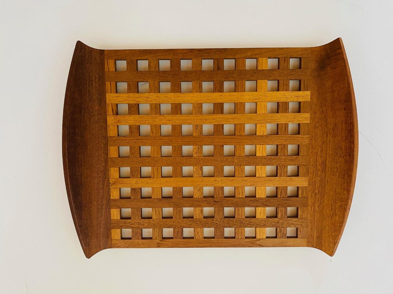 Incredible and beautiful design on this large solid teak, a tray designed by Quistgaard for Dansk, circa the 1950s, great condition with raised edges, incredible craftsmanship. early stamp at the bottom. Beautiful effect on the lattice design and