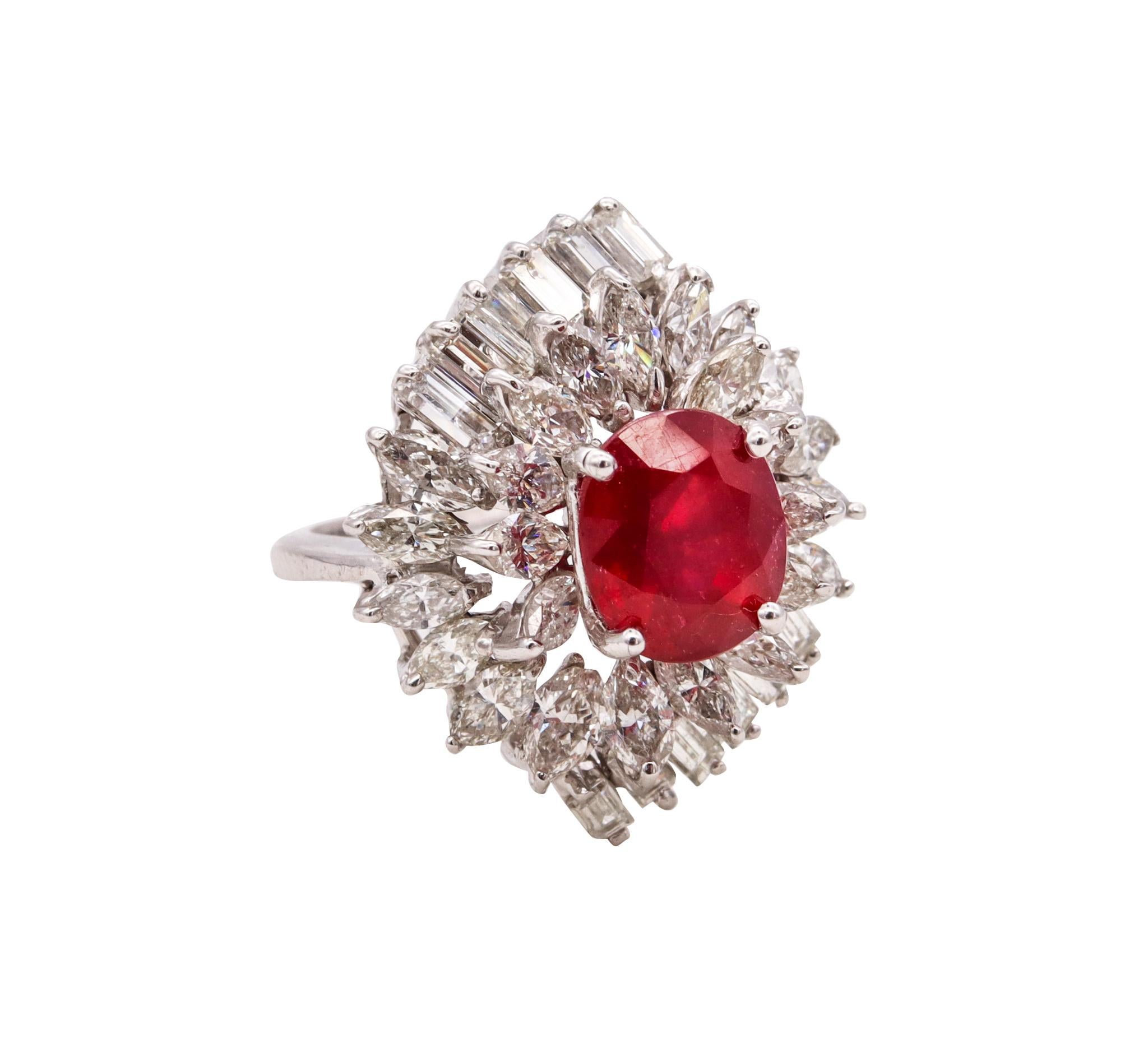 Jeweled cluster cocktail ring.

Very handsome piece created during the American mid-century period, circa 1960. This cocktail ring was crafted, with Hollywood regency patterns in solid white gold of 14 karats and is embellished with a cluster of
