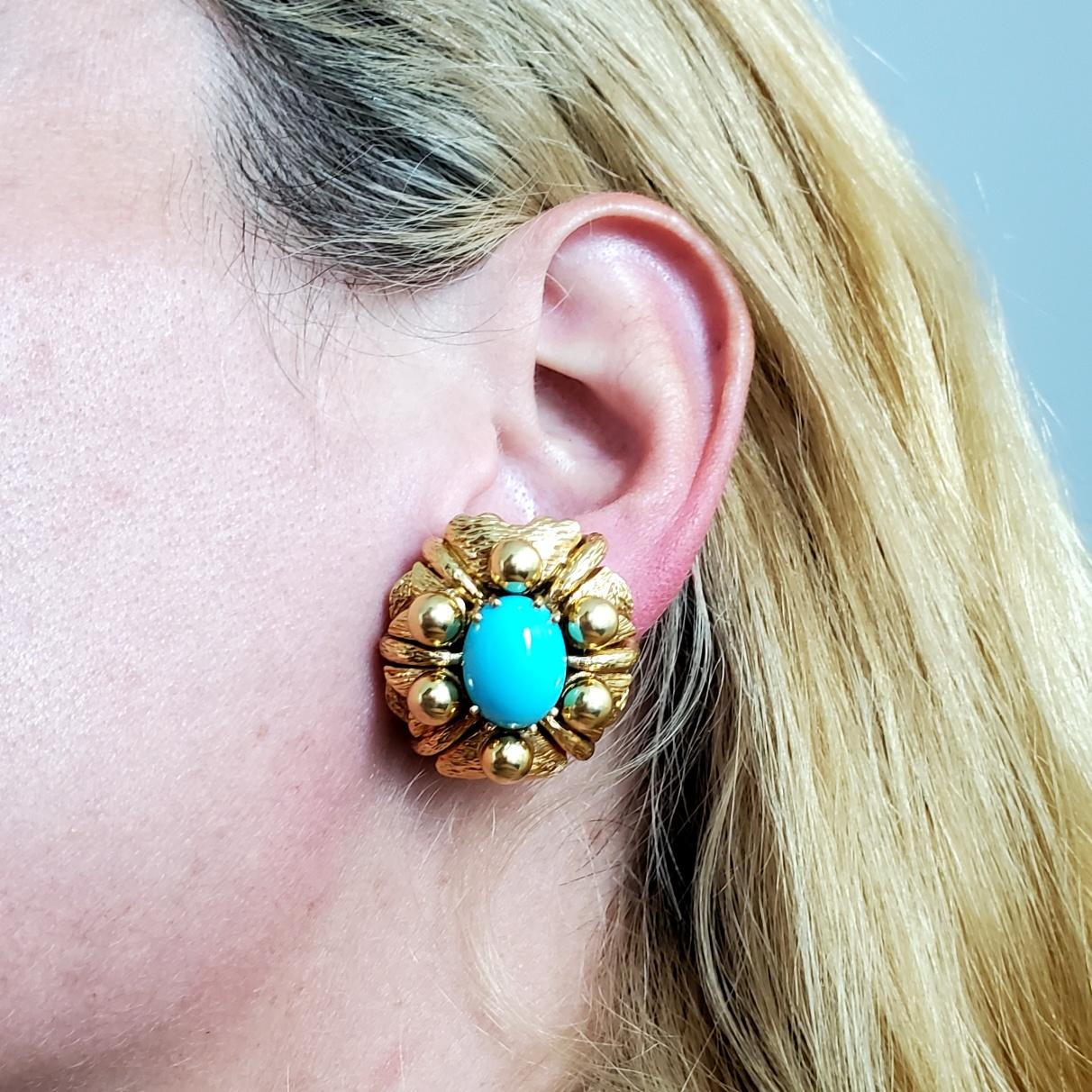 Bold earrings with Sleeping Beauty Turquoises.

Beautiful bold pair of clip-on earrings, created in Italy during the mid century period, back in the 1960's. They has been crafted in a three dimensional bombe shape in solid yellow gold of 18 karats