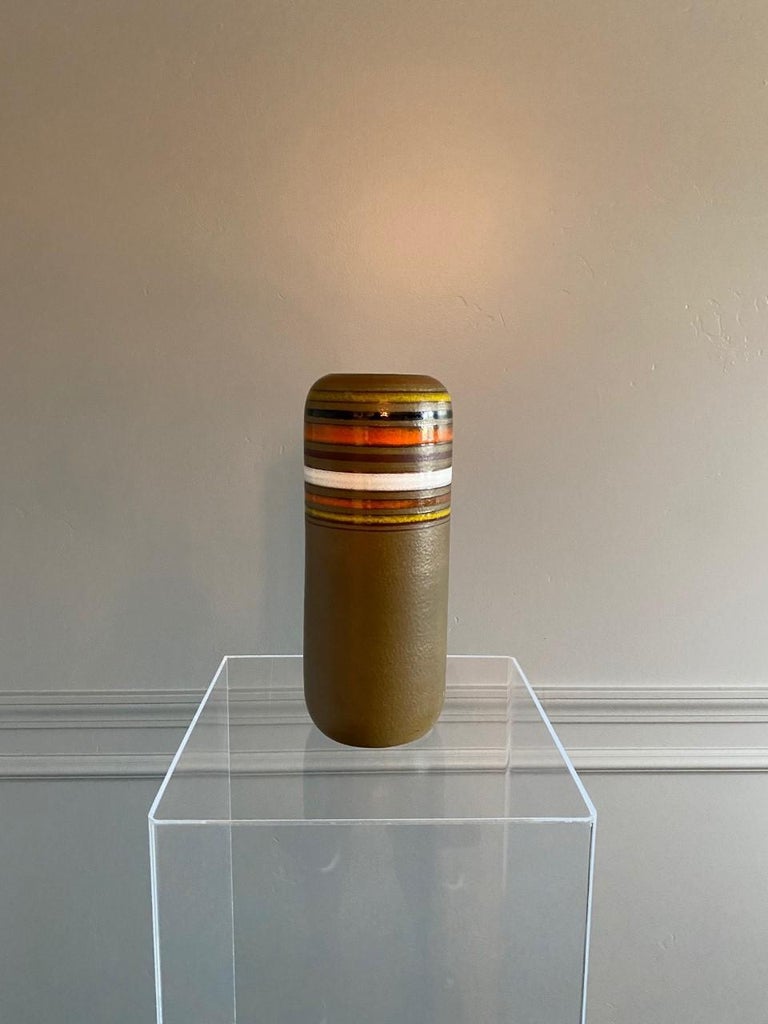 Created by Bitossi’s creative director, Aldo Londi and distributed worldwide by Rosenthal Netter. Midcentury Italian art pottery vase by Rosenthal Netter for Bitossi. Undeniably midcentury classic piece. Cylindrical vase with a classic palette