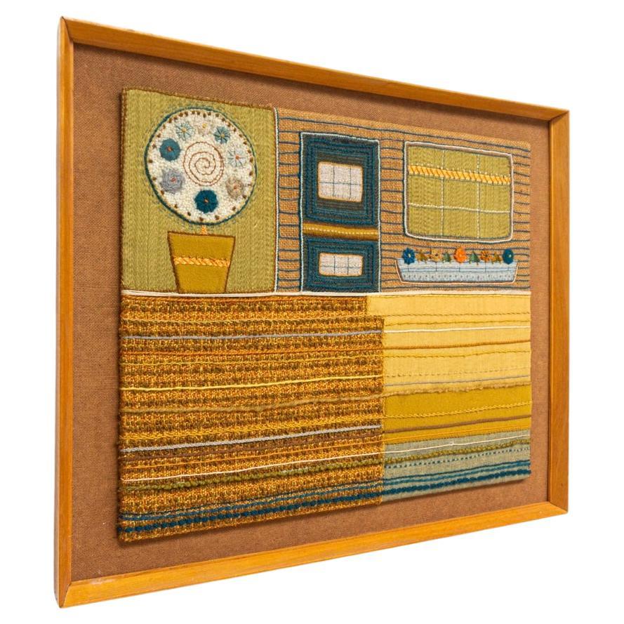 Mid-Century Modern 1960s framed wall Tapestry Art in original vintage wood frame mounted on board and displays exceptional skill and detail to pattern and color by the creator whose name is unknown. Striking earthy tones of mustard, brown, green,