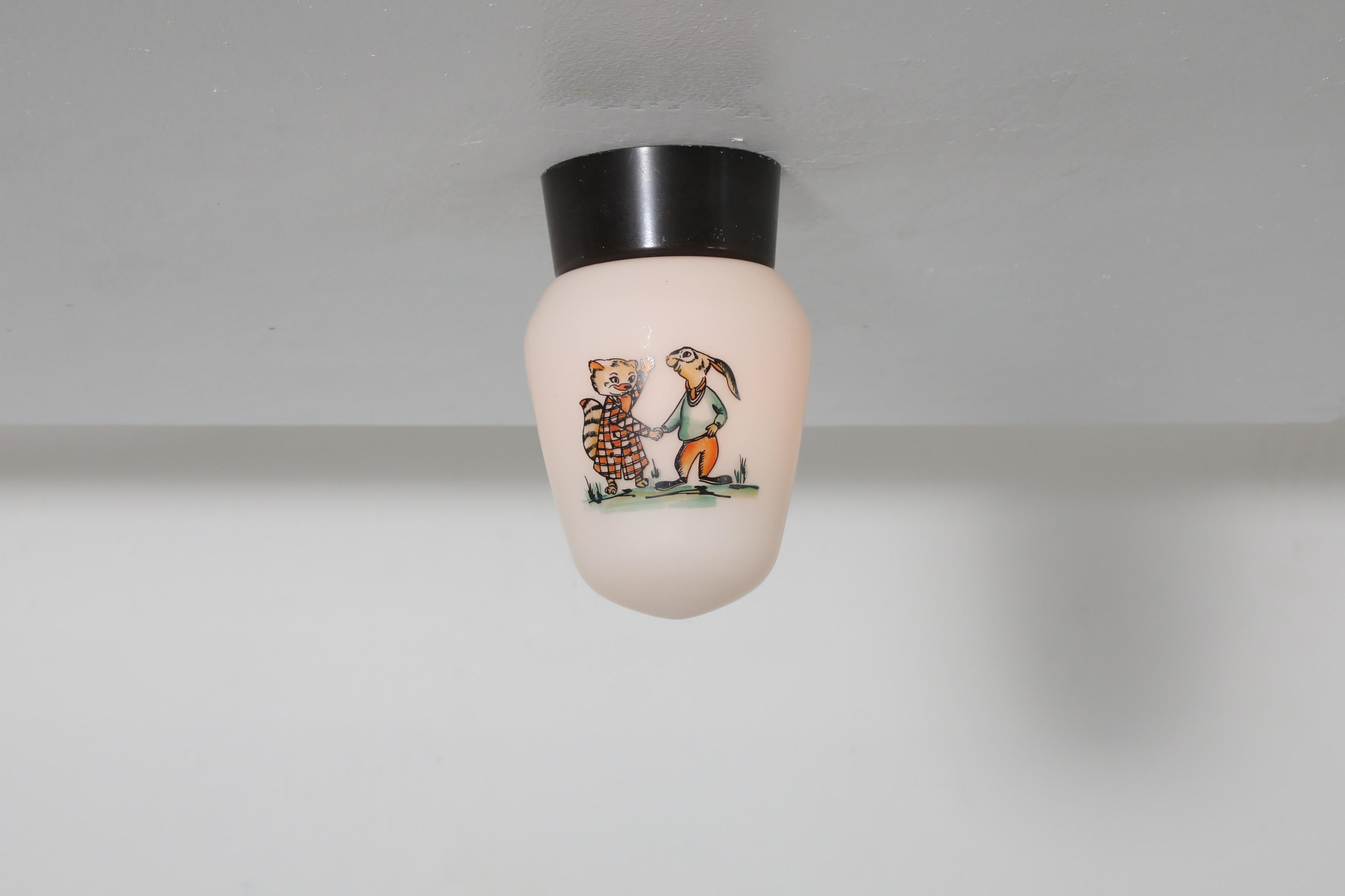 Belgian Mid-Century, 1960's Bo-Niko ceiling light with bakelite base and milk glass shade with cartoon print. A beautiful 1960's ceiling light for a closet, child room or fun entryway. In original condition with wear consistent with age and use. 