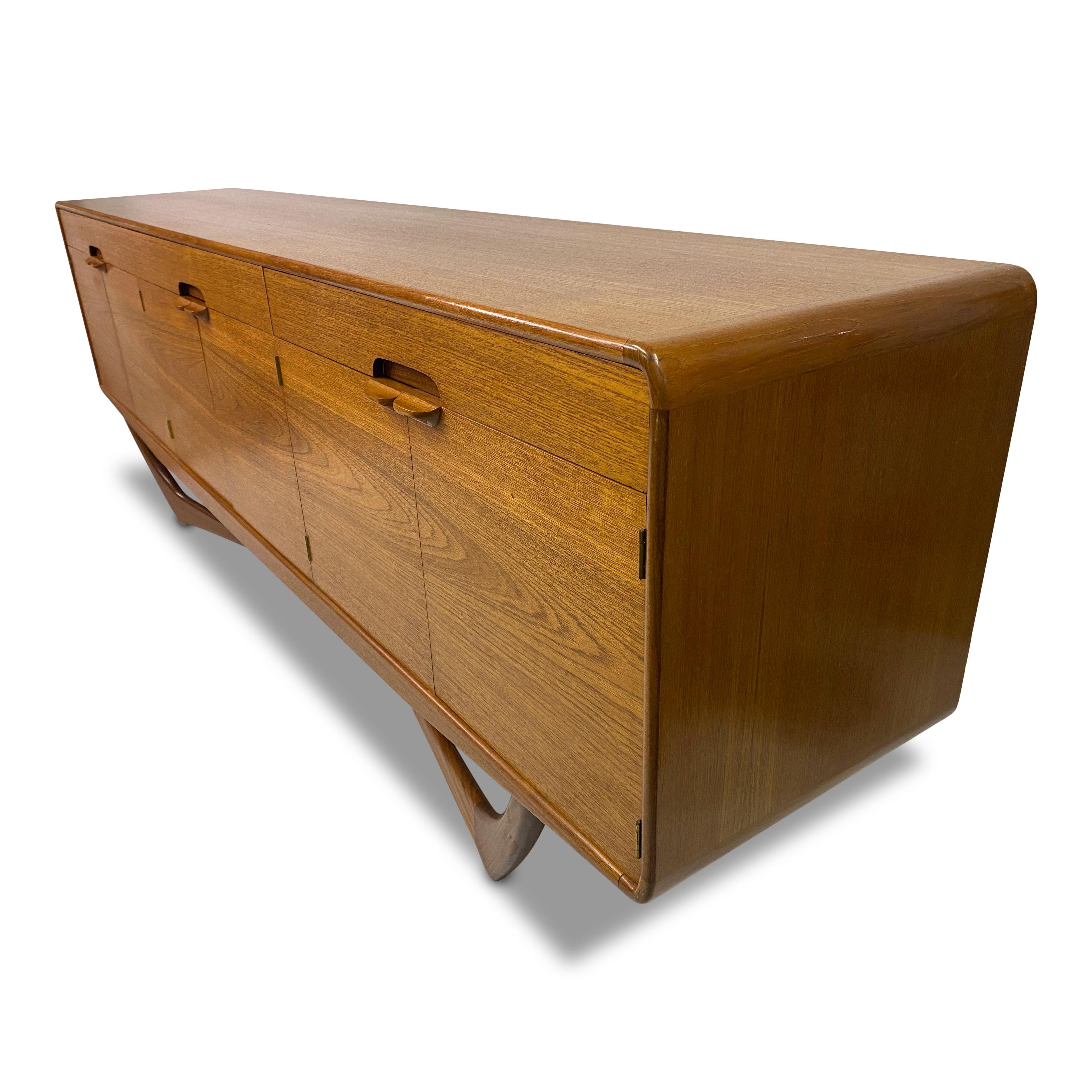 Teak sideboard

By Beithcraft

Desirable cross base model

Rarer four door version

Scotland 1960s.