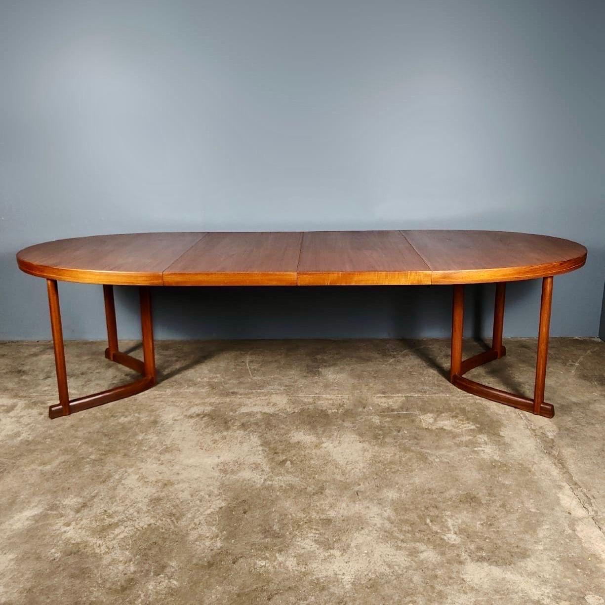New Stock ✅

Mid Century 1960s Danish Dining Table By Johannes Andersen Vintage Retro MCM

A stunning teak Danish dining table by Johannes Andersen dating from 1960’s.

Featuring a large oval top, which can be extended by adding either one or two