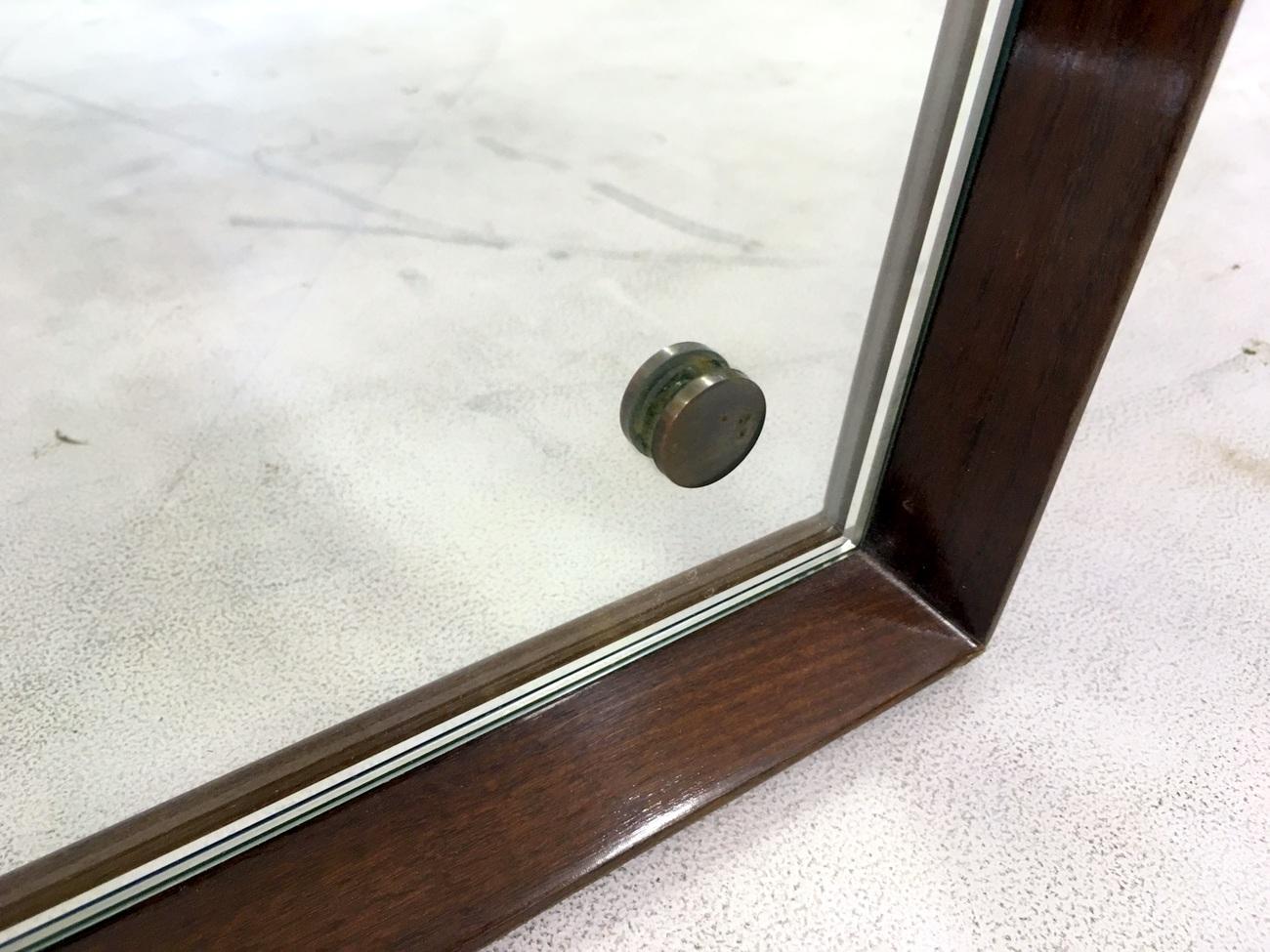 Wooden framed mirror

Octagonal

Brass buttons

Italian 1960s.