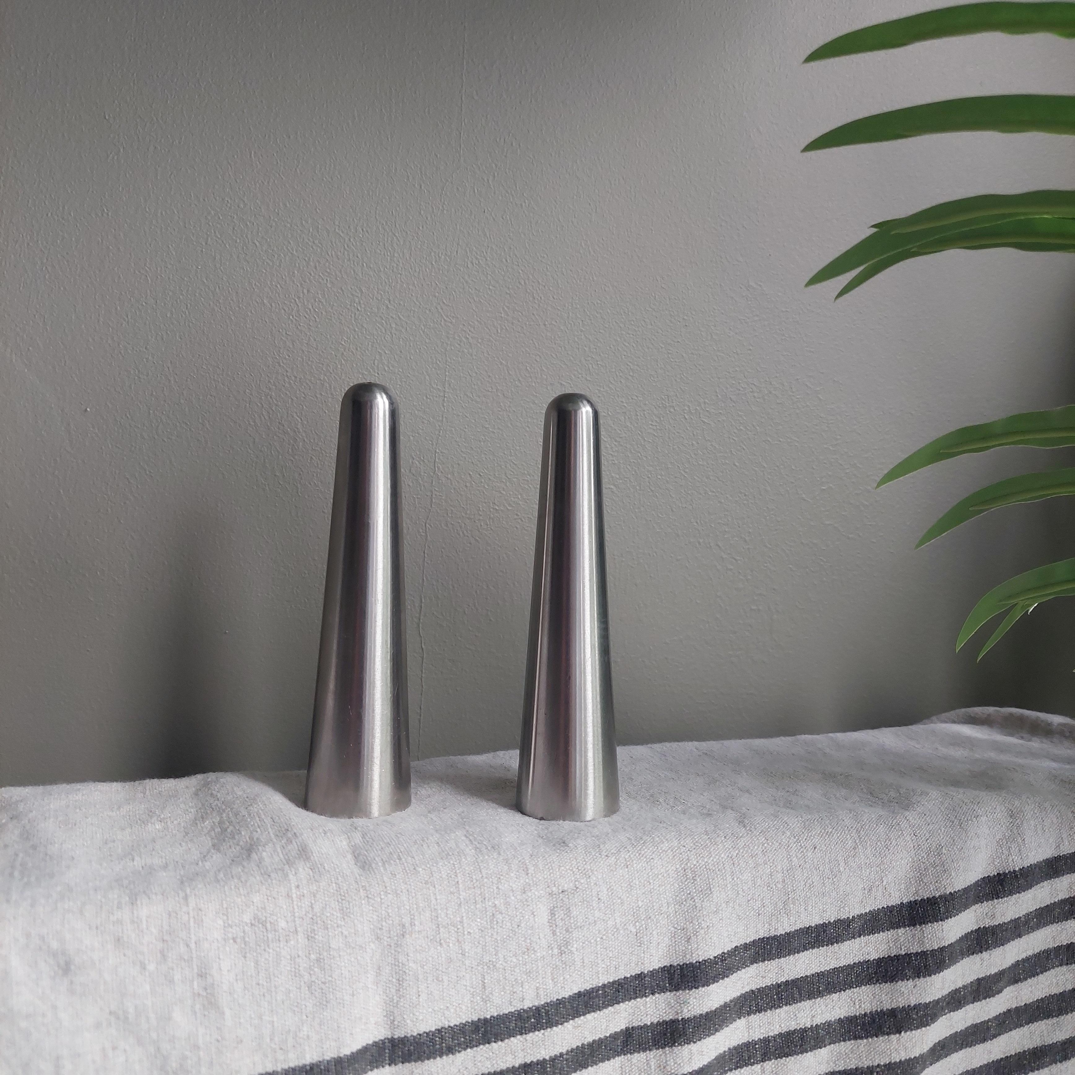 Stylish vintage mid century modern stainless steel salt and pepper cruet set designed by Robert Welch for Old Hall.

Salt and pepper shaker from the 'Campden' range, stainless steel, of tall tapered shape, made of heavy thick gauge metal so that the