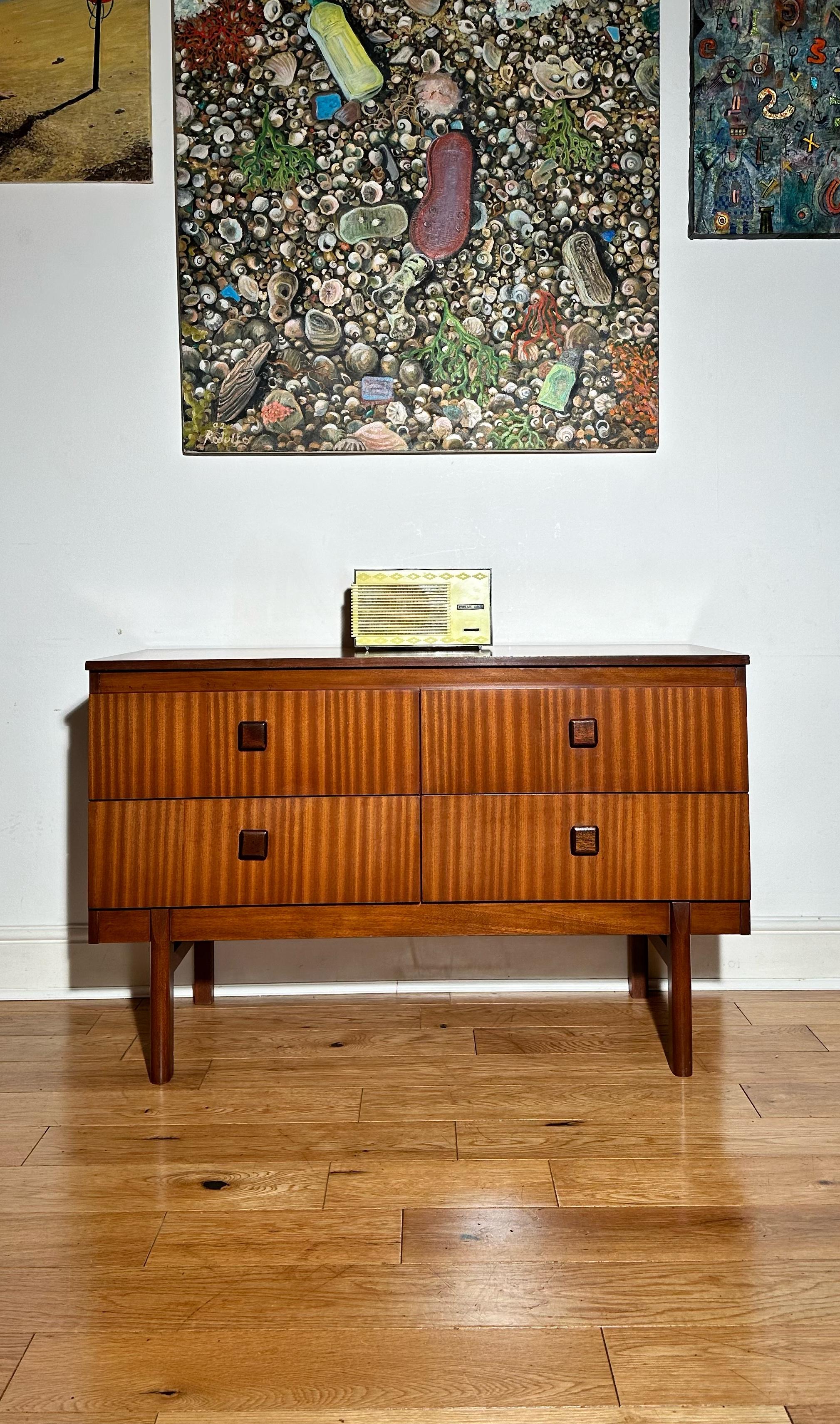 We’re happy to provide our own competitive shipping quotes with trusted couriers. Please message us with your postcode for a more accurate price. Thank you.

Mid Century Modern teak double chest of drawers / small sideboard by Remploy.
It features